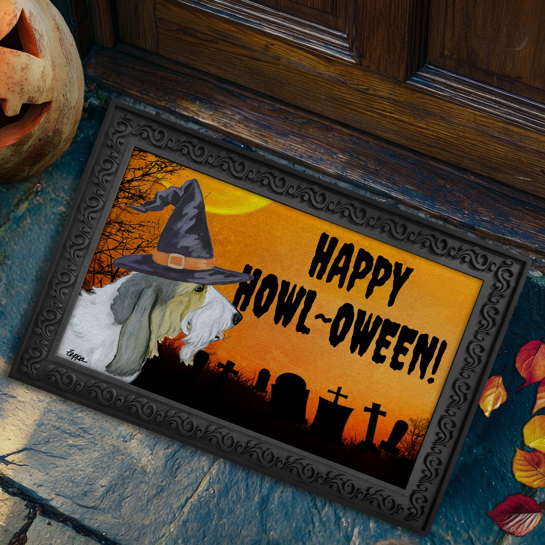 Halloween-themed doormat with a Grand Basset Griffon Vendeen wearing a witch hat and 'Happy Howl-Oween!' text, placed on a stone surface.