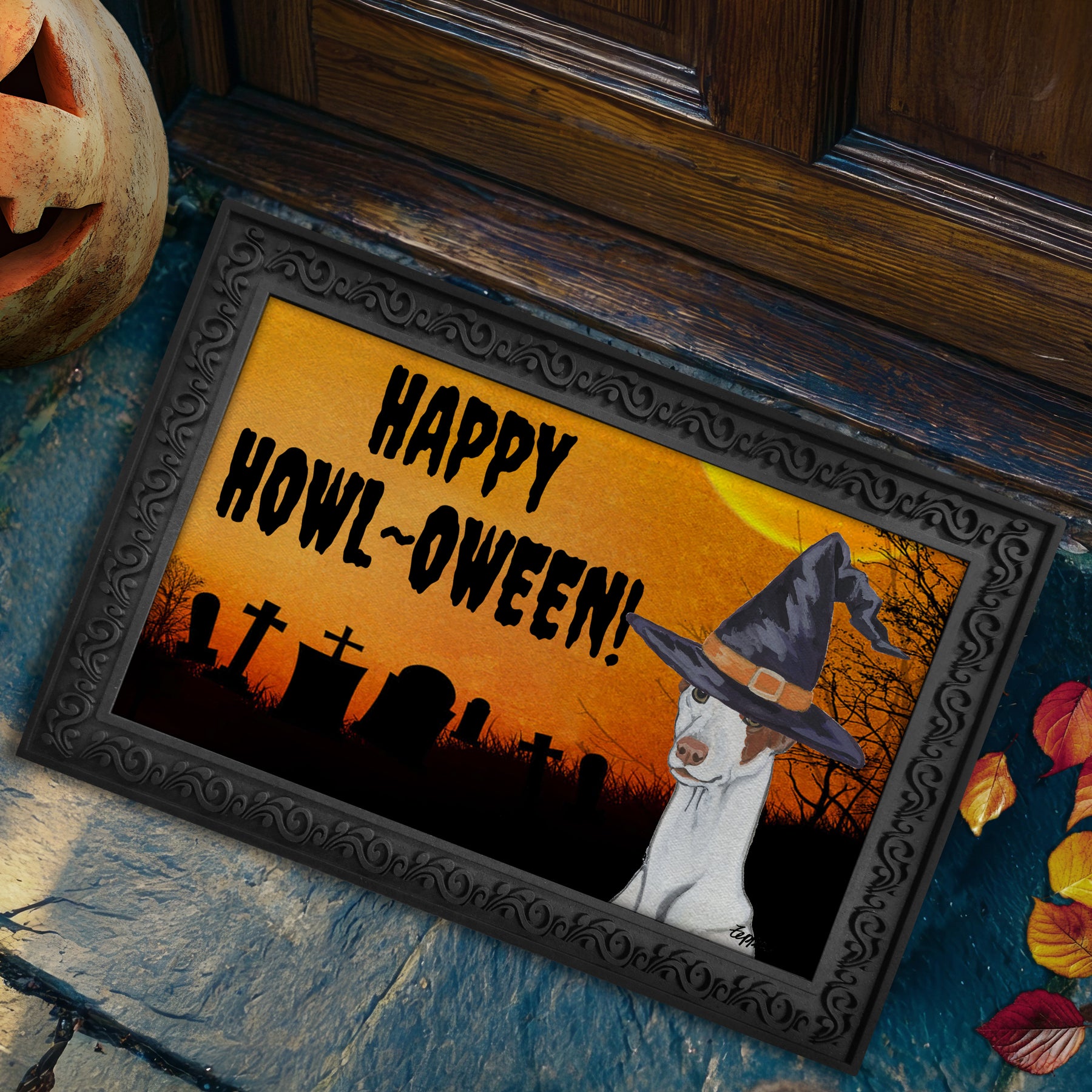 Ibizan Hound in a witch's hat on a Happy Howl-ween doormat.