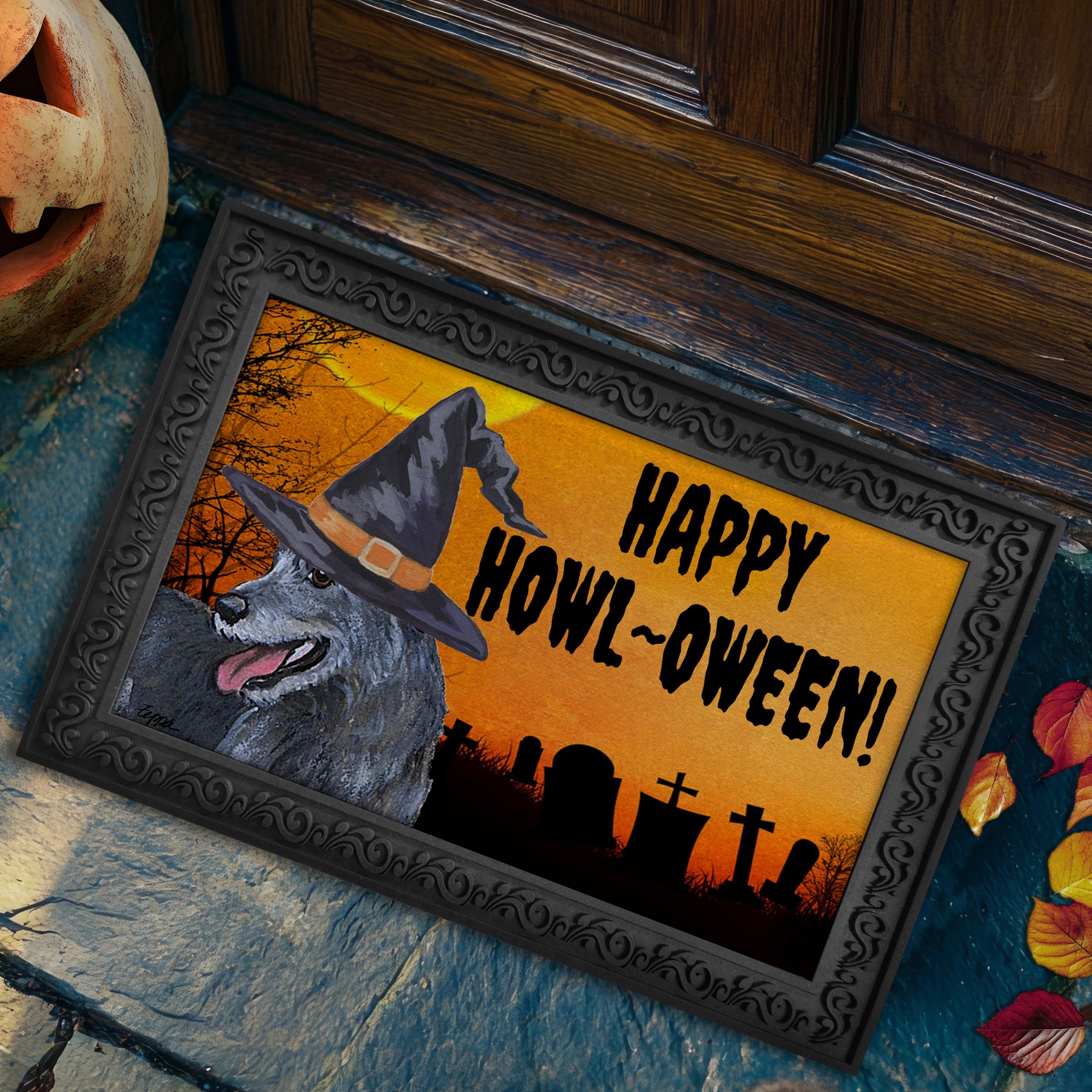 Halloween-themed doormat with a Irish Wolfhound wearing a witch hat and 'Happy Howl-Oween!' text, placed on a stone surface.