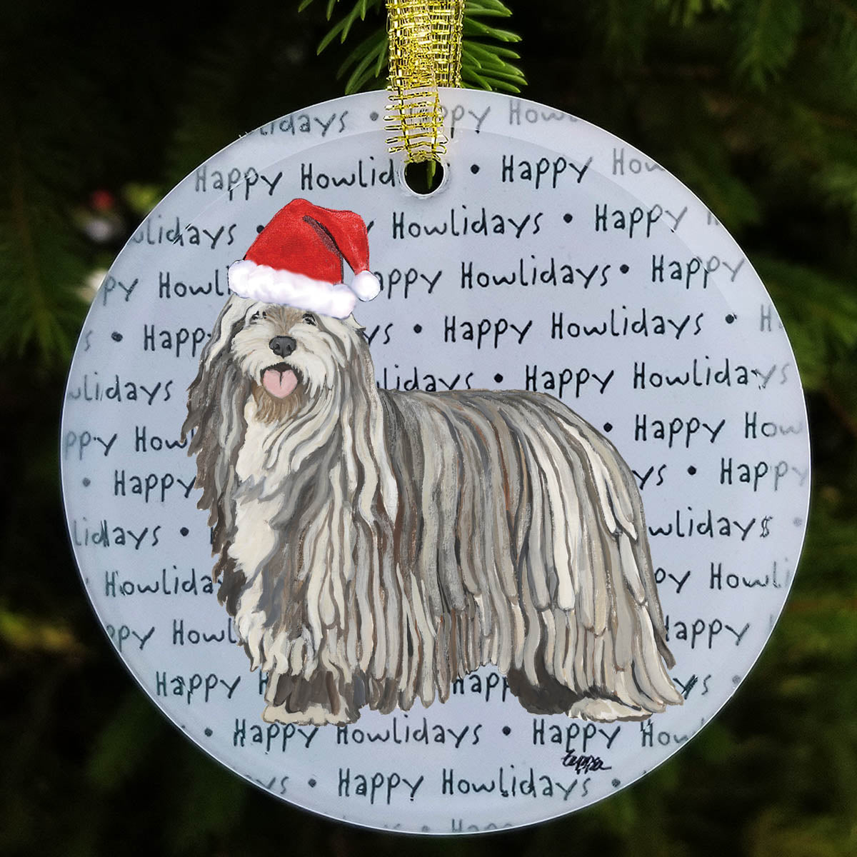 Glass Christmas ornament with a Bergamasco wearing a Santa hat on a background of 'Happy Howlidays' text