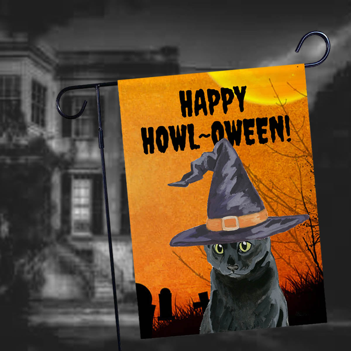 Happy Halloween Garden Flag in front of a haunted house.