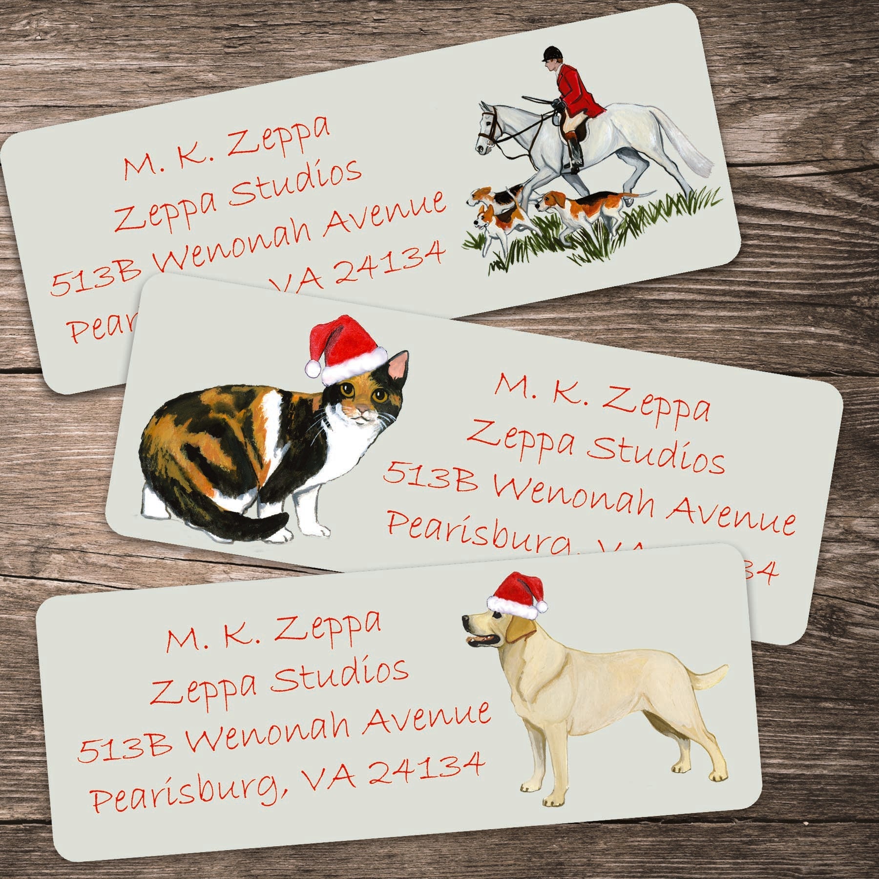 3 Christmas Return Address Labels with animal designs on a wooden background.