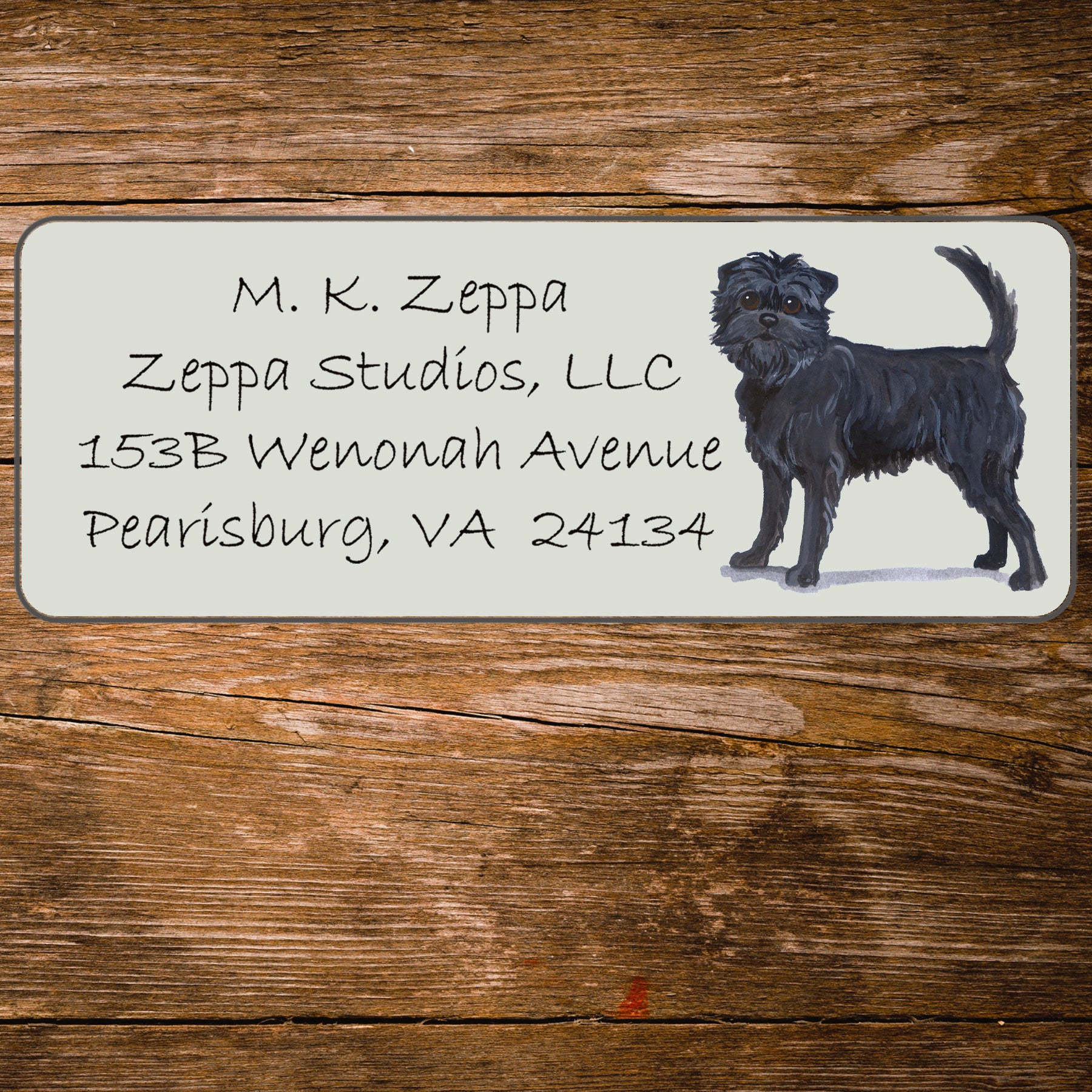 Address label with an Affenpinscher illustration on a wooden background