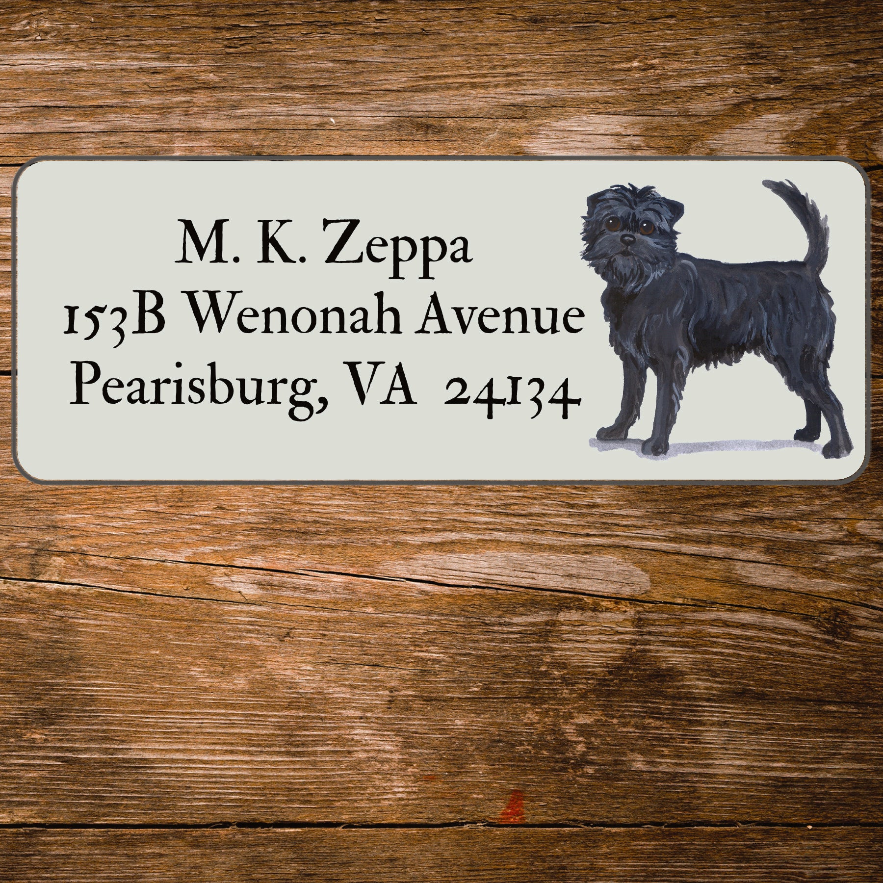Address label with an Affenpinscher illustration on a wooden background