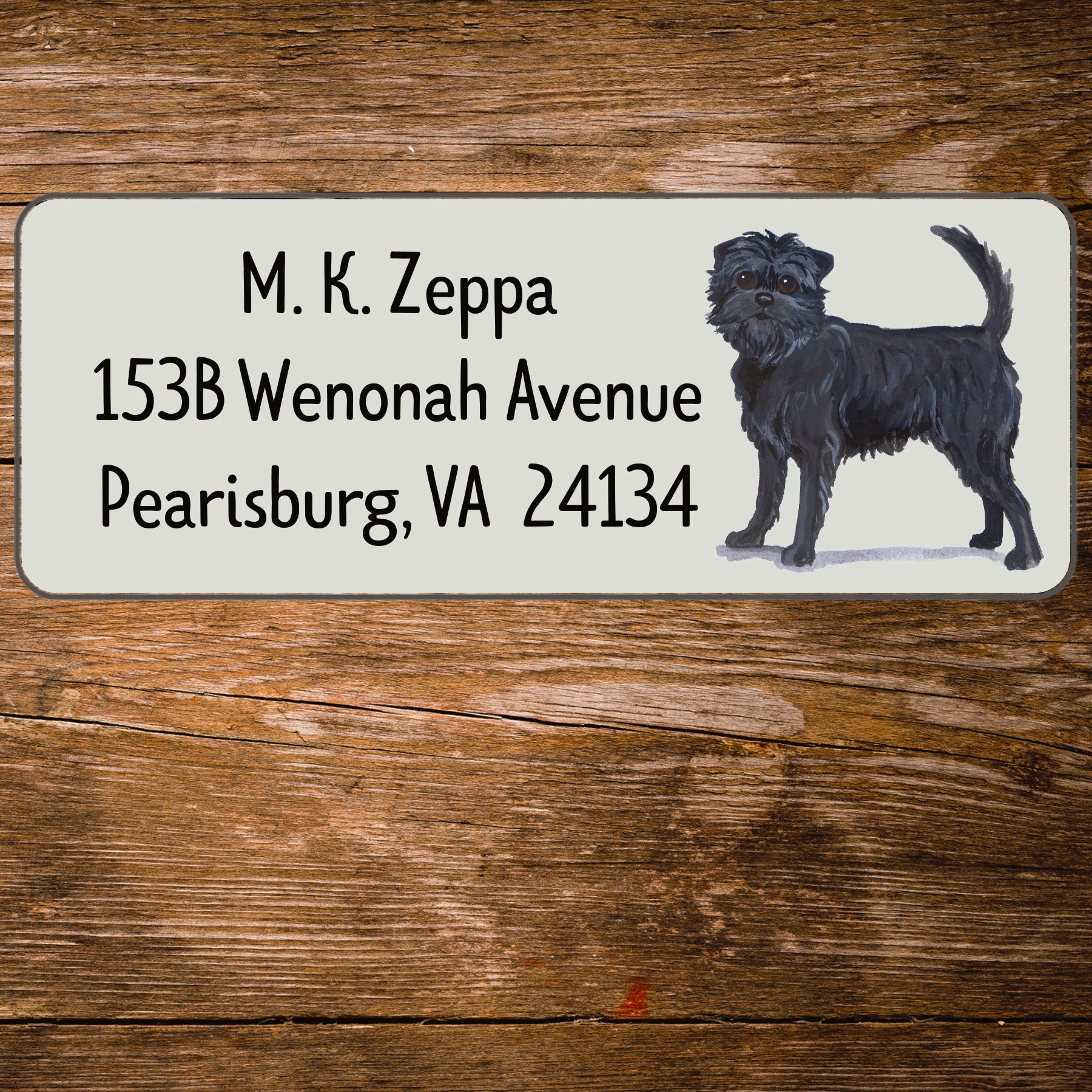 Address label with an Affenpinscher illustration on a wooden background