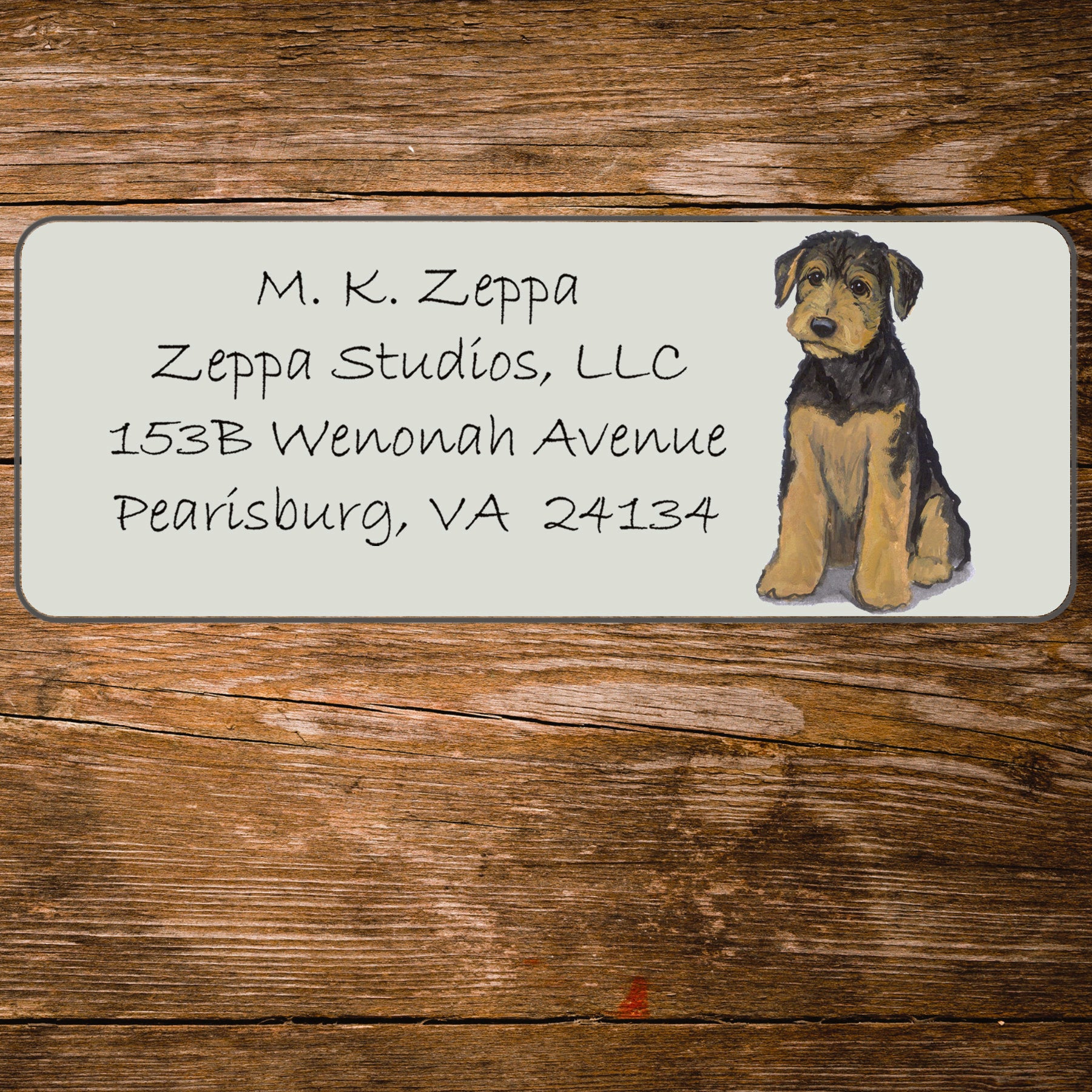 Address label with an Airedale Terrier Puppy illustration on a wooden surface