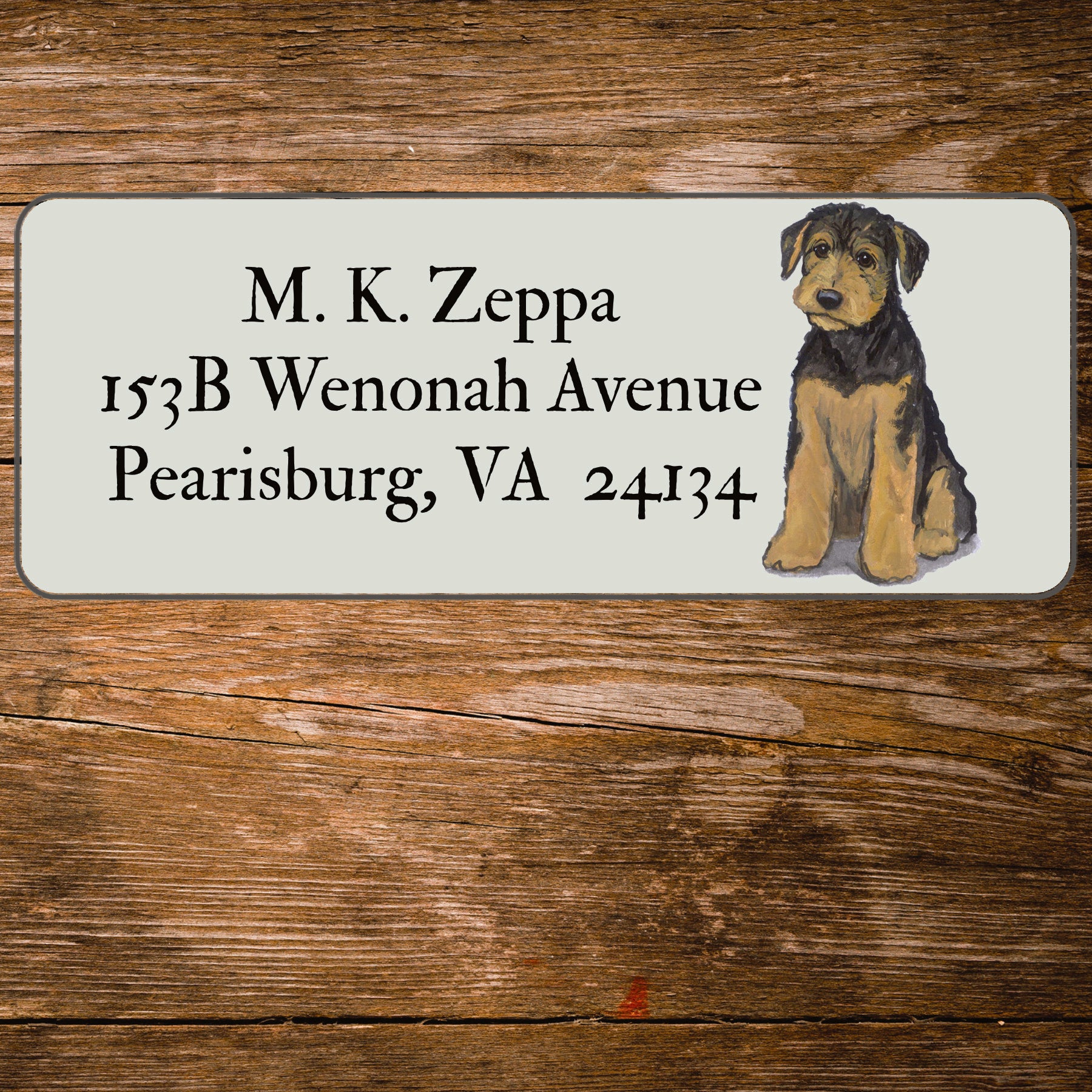 Address label with an Airedale Terrier Puppy illustration on a wooden surface