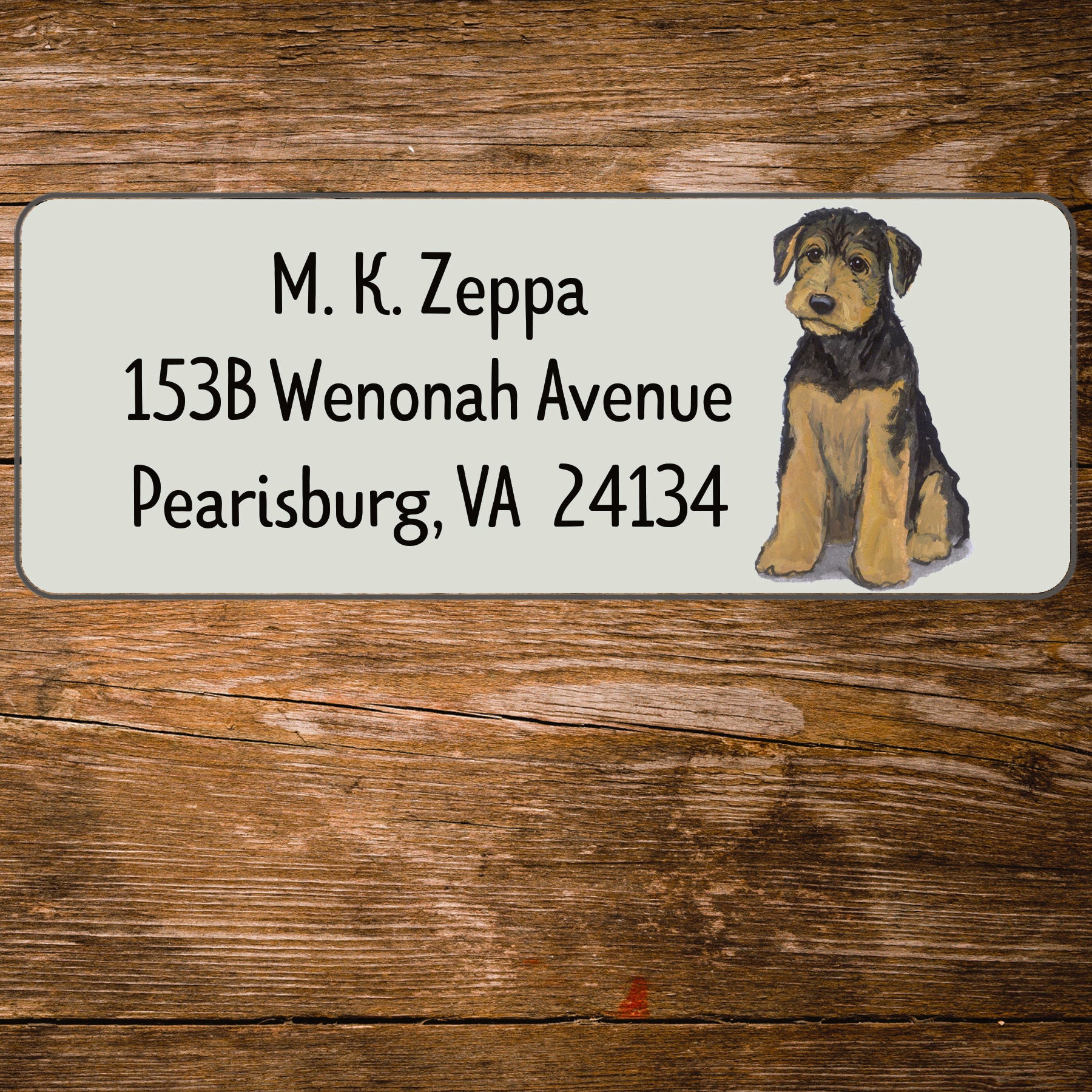 Address label with an Airedale Terrier Puppy illustration on a wooden surface