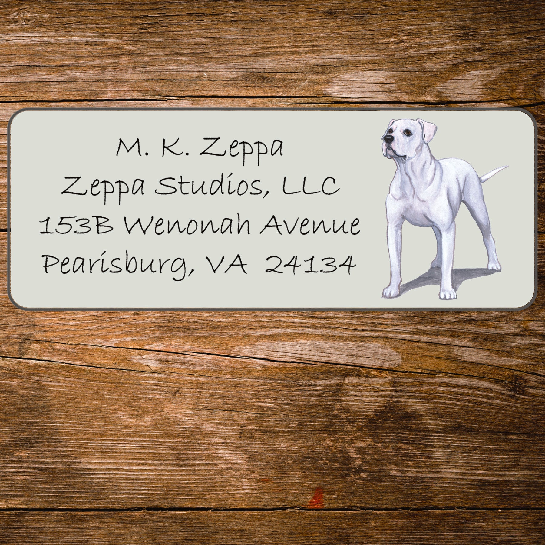 Address label with an American Bulldog illustration on a wooden surface