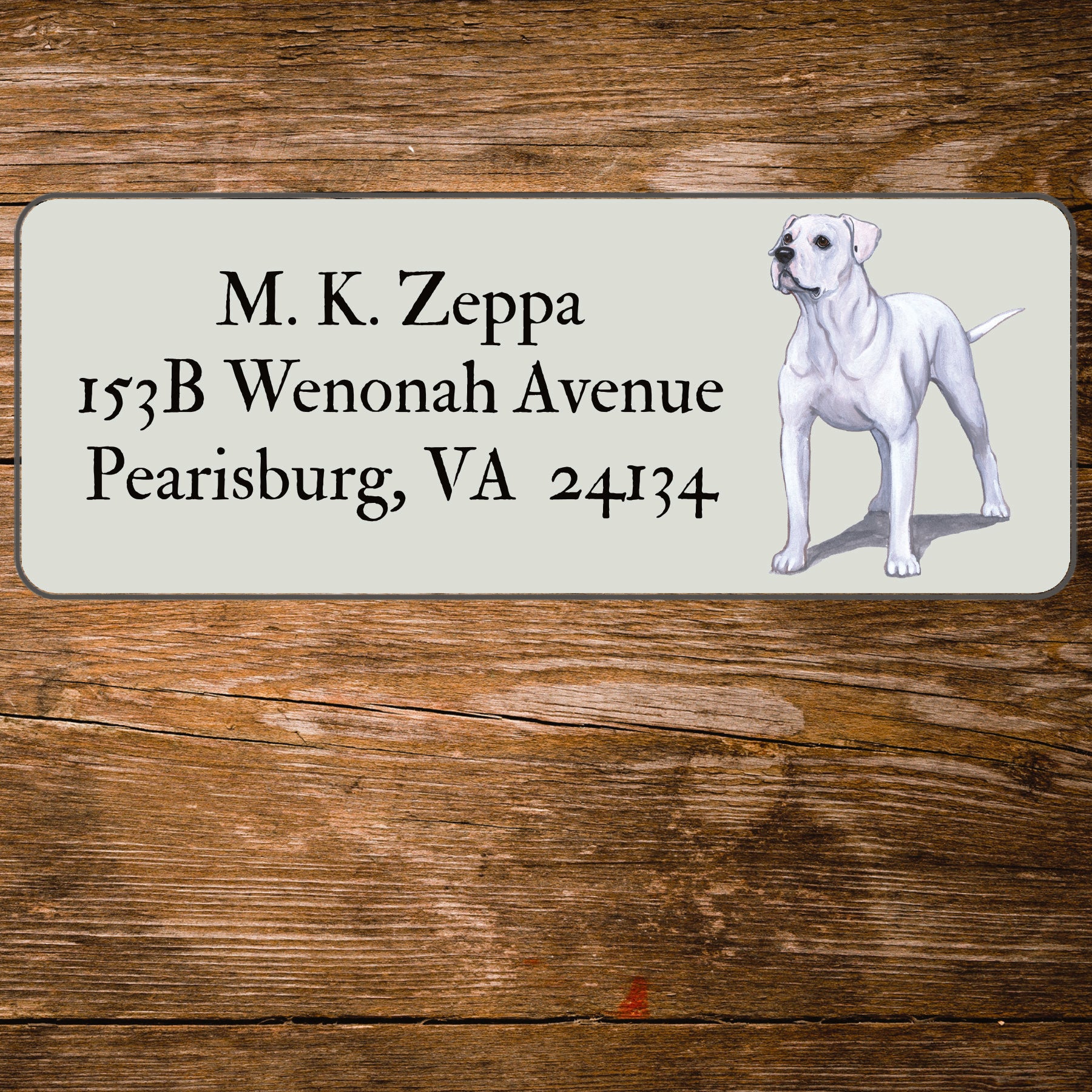 Address label with an American Bulldog illustration on a wooden surface