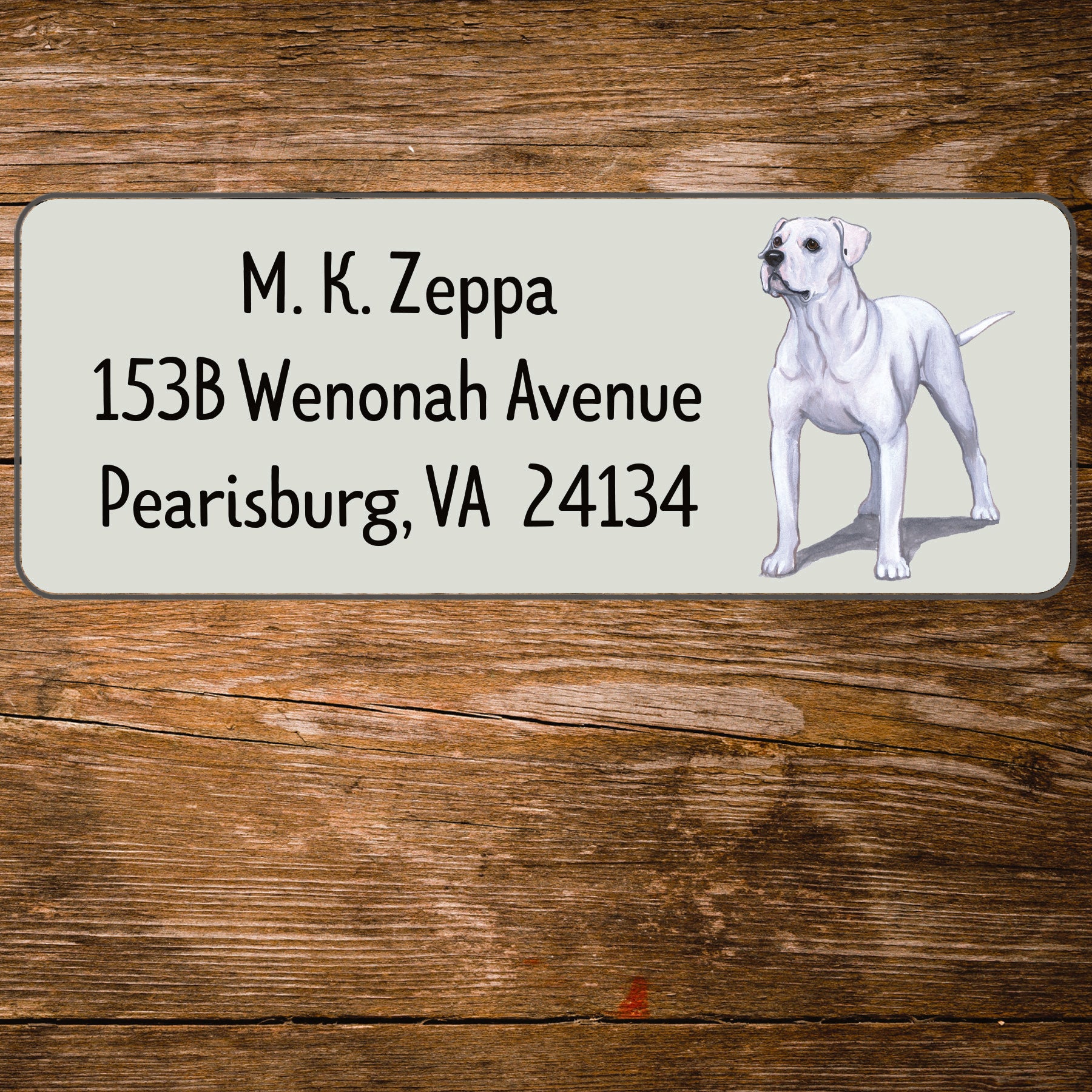 Address label with an American Bulldog illustration on a wooden surface
