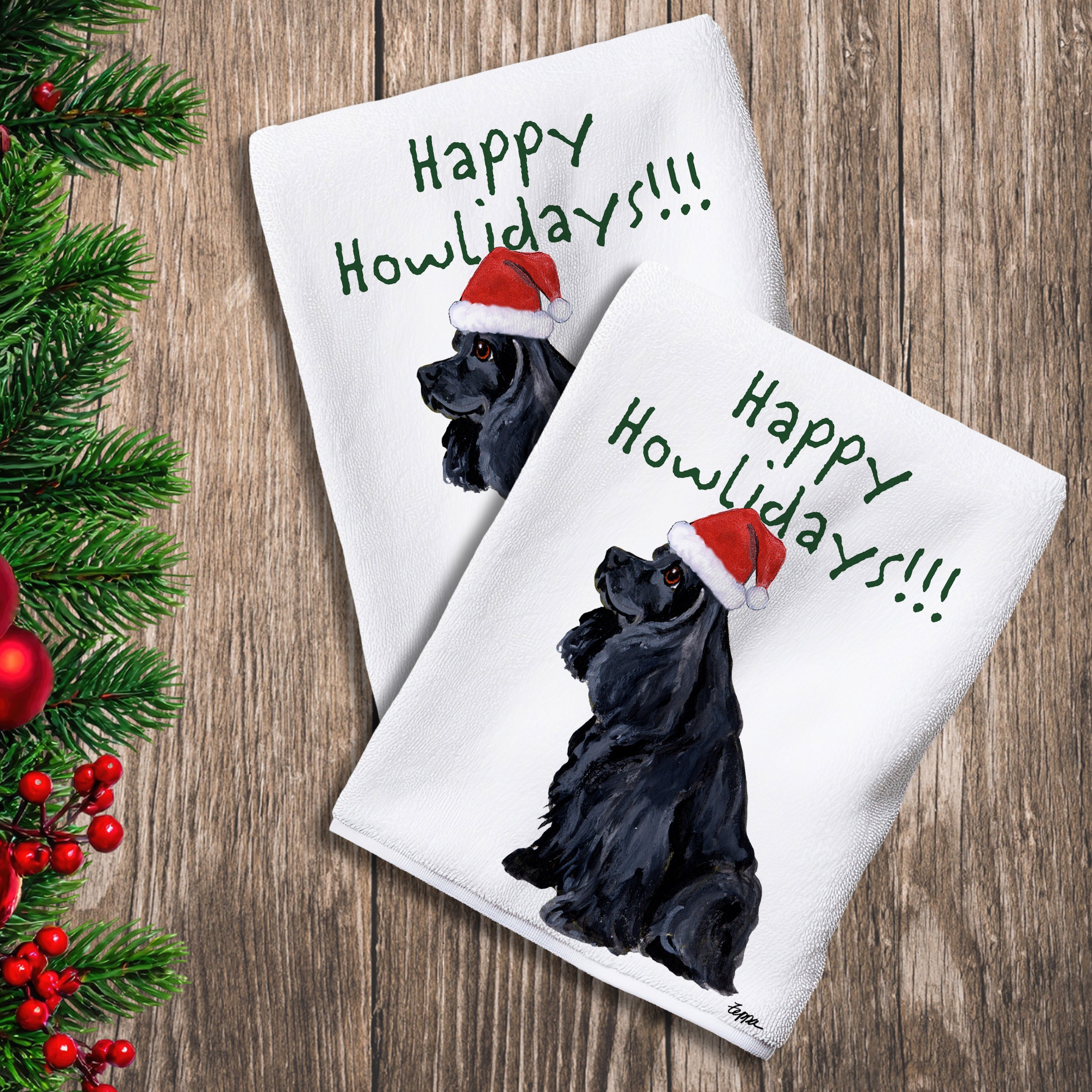 2 Kitchen Towels with a black American Cocker Spaniel in a Santa Hat and Happy Howlidays text.