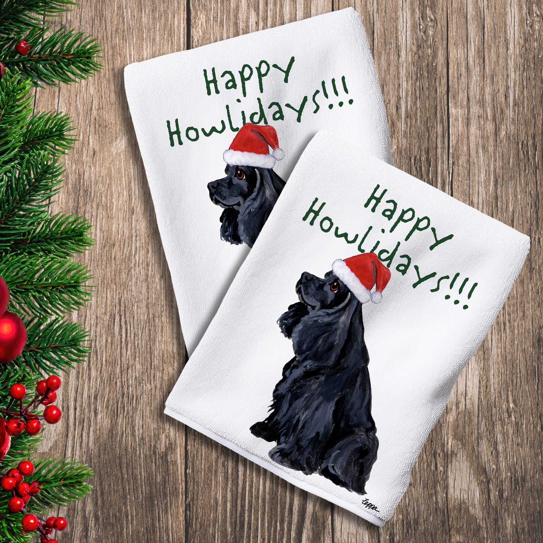 2 Kitchen Towels with a black American Cocker Spaniel in a Santa Hat and Happy Howlidays text.