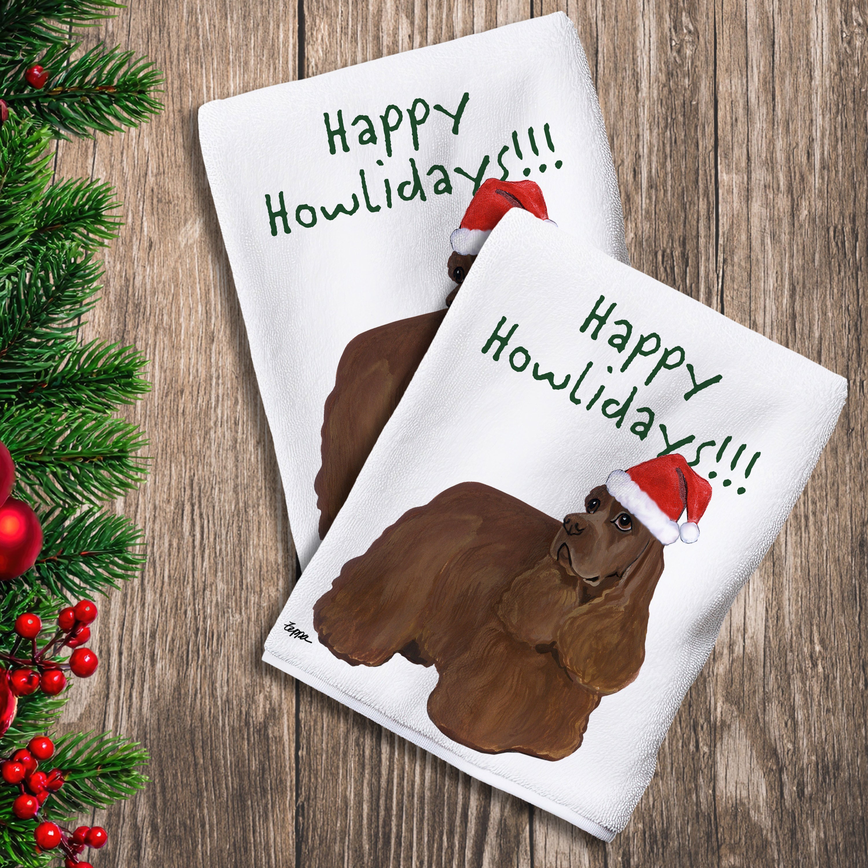 2 Kitchen Towels with a chocolate American Cocker Spaniel in a Santa Hat and Happy Howlidays text.