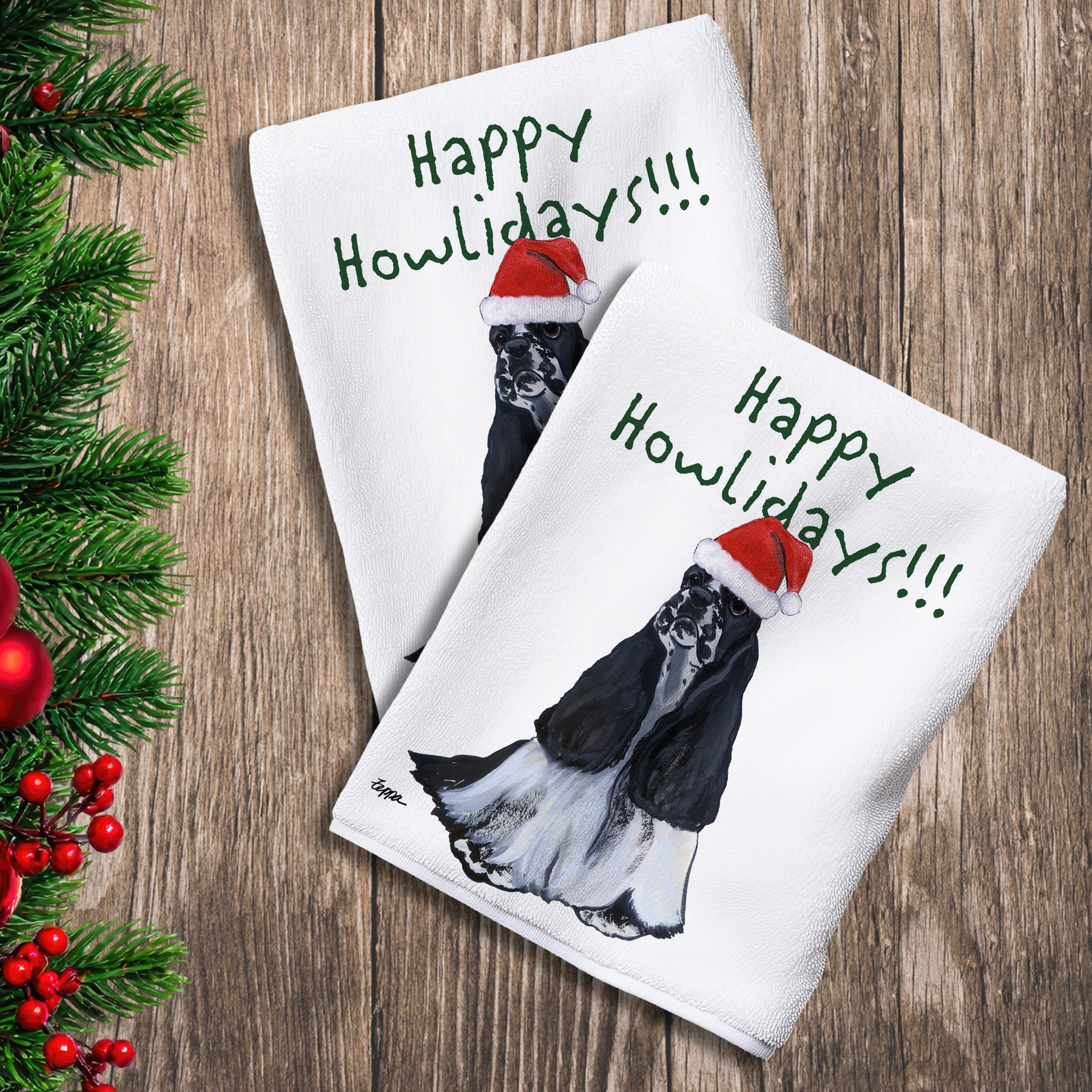 2 Kitchen Towels with a black and white American Cocker Spaniel in a Santa Hat and Happy Howlidays text.