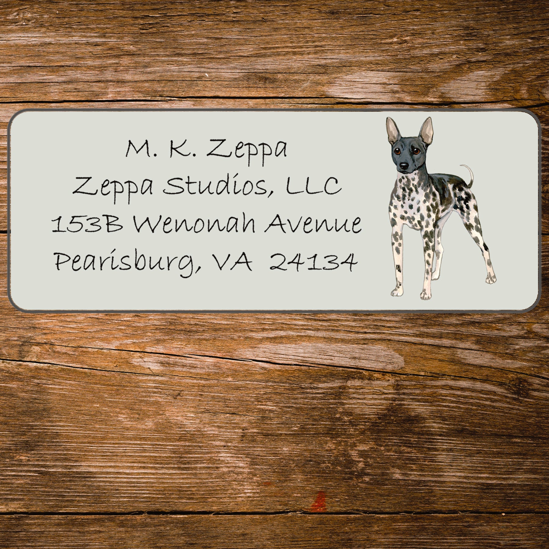Return address label with an illustration of an American Hairless Terrier