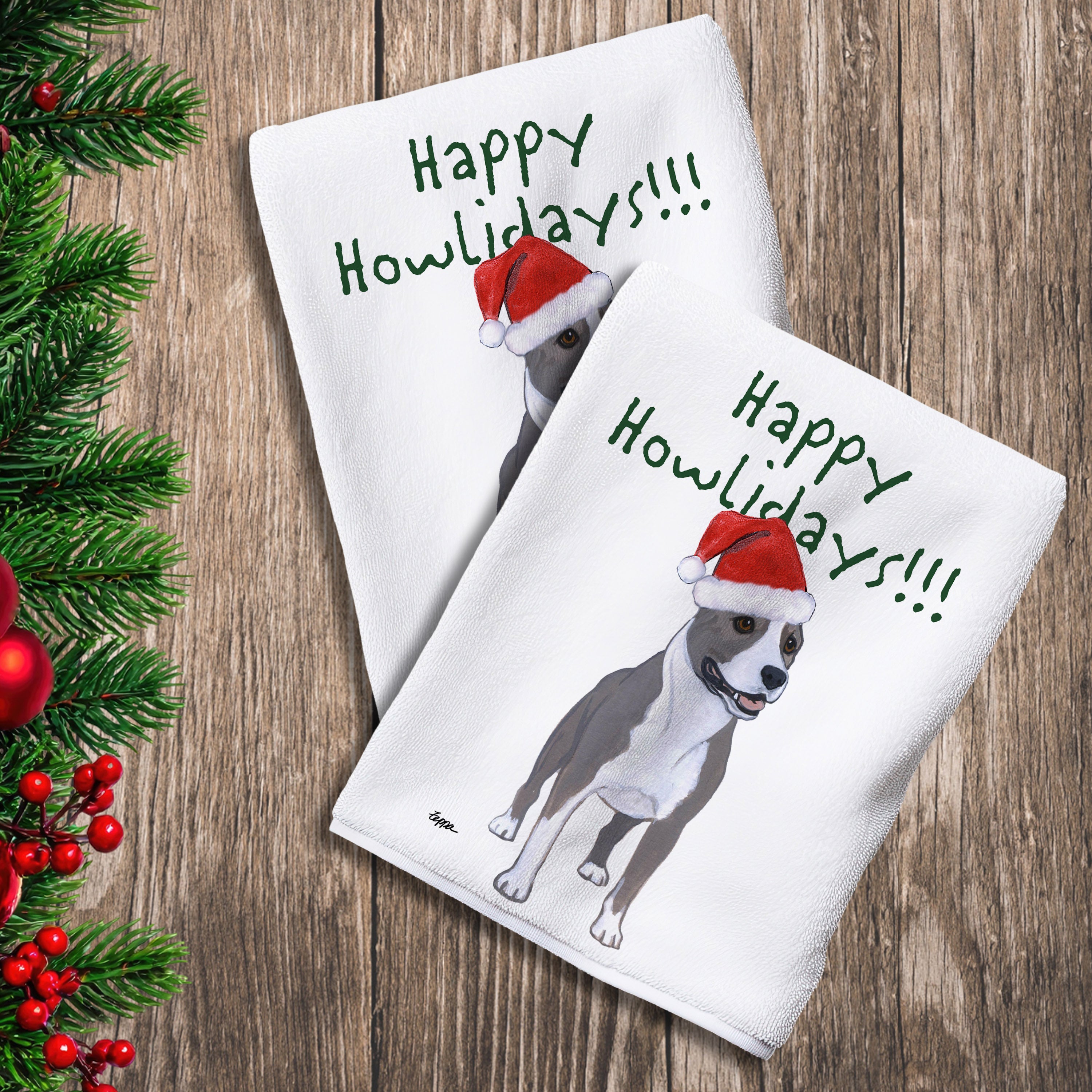 2 Kitchen Towels with an American Staffordshire Terrier in a Santa Hat and Happy Howlidays text.