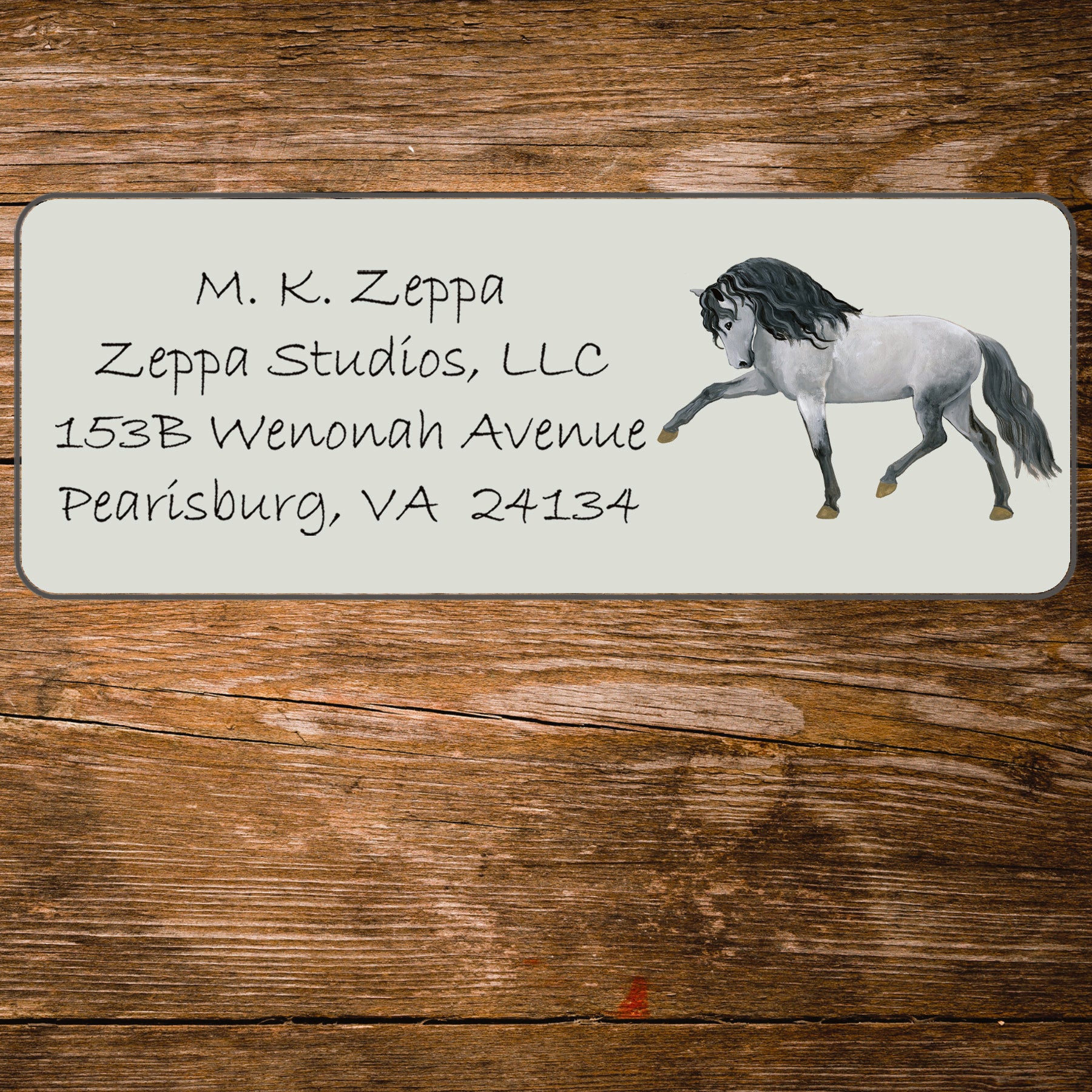 Return address label with an illustration of an Andalusian Horse.