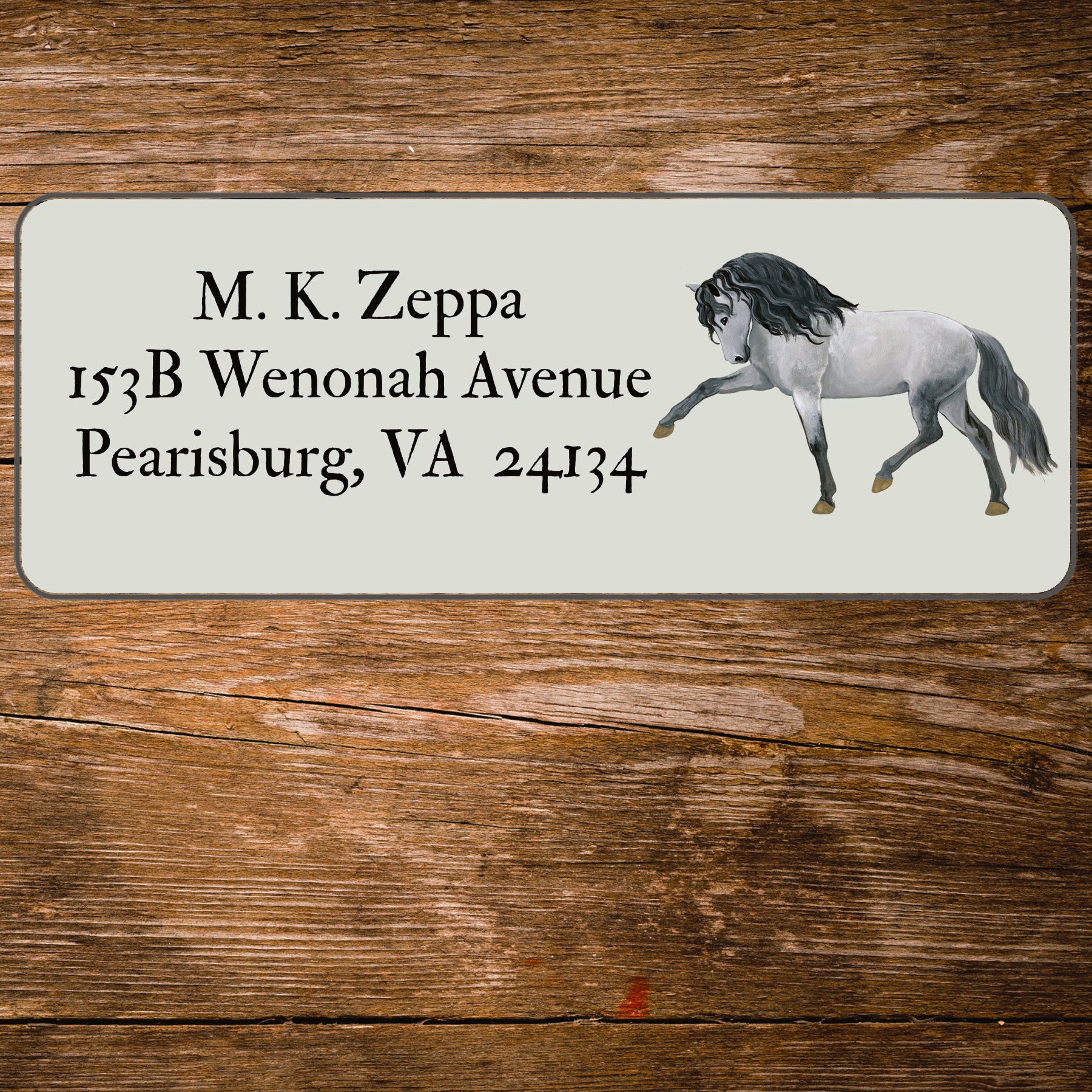 Return address label with an illustration of an Andalusian Horse.