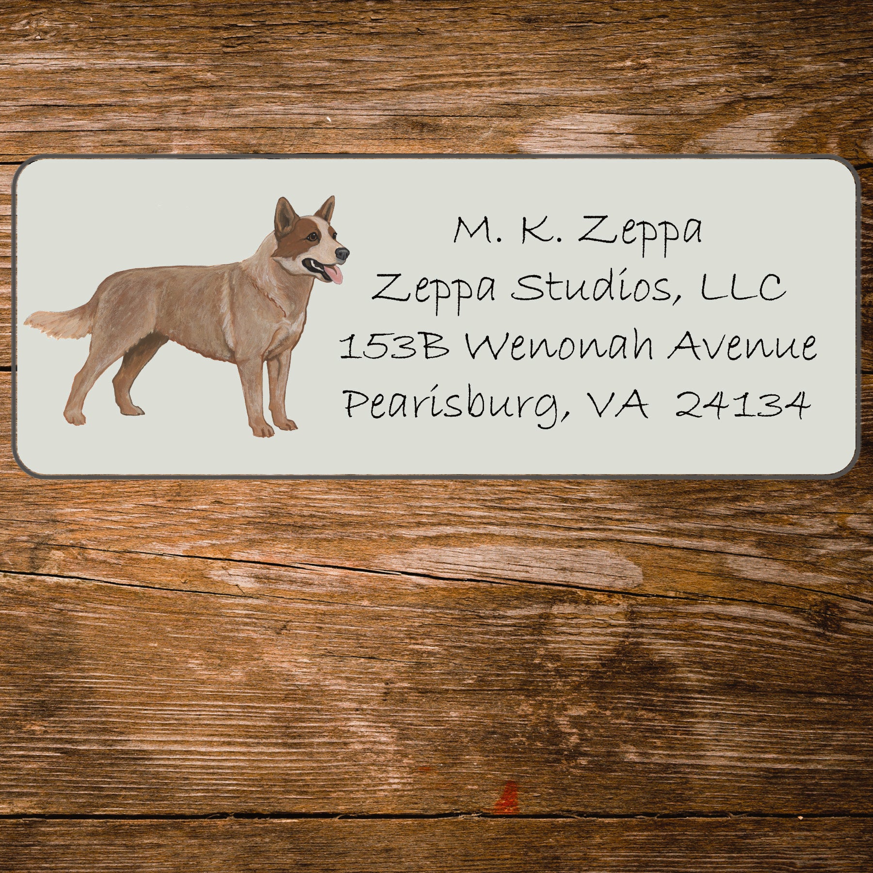 Return address label with an Australian Cattle Dog illustration on a wooden surface