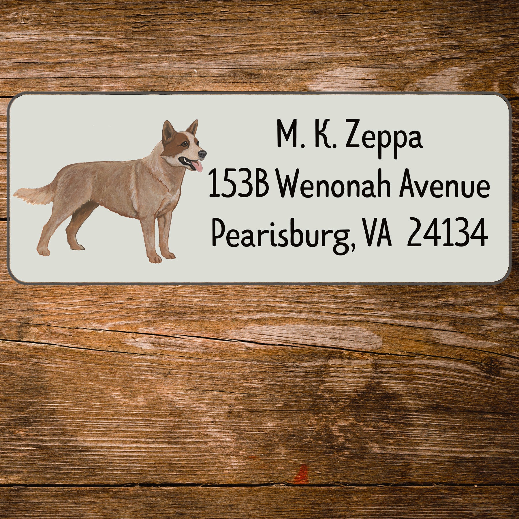 Return address label with an Australian Cattle Dog illustration on a wooden surface
