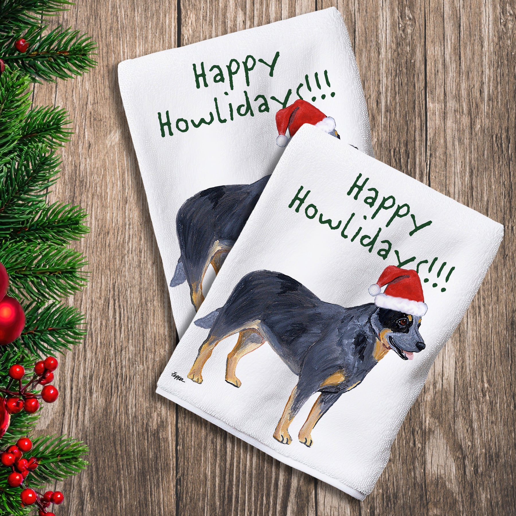 2 Kitchen Towels with an Australian Cattle Dog in a Santa Hat and Happy Howlidays text.