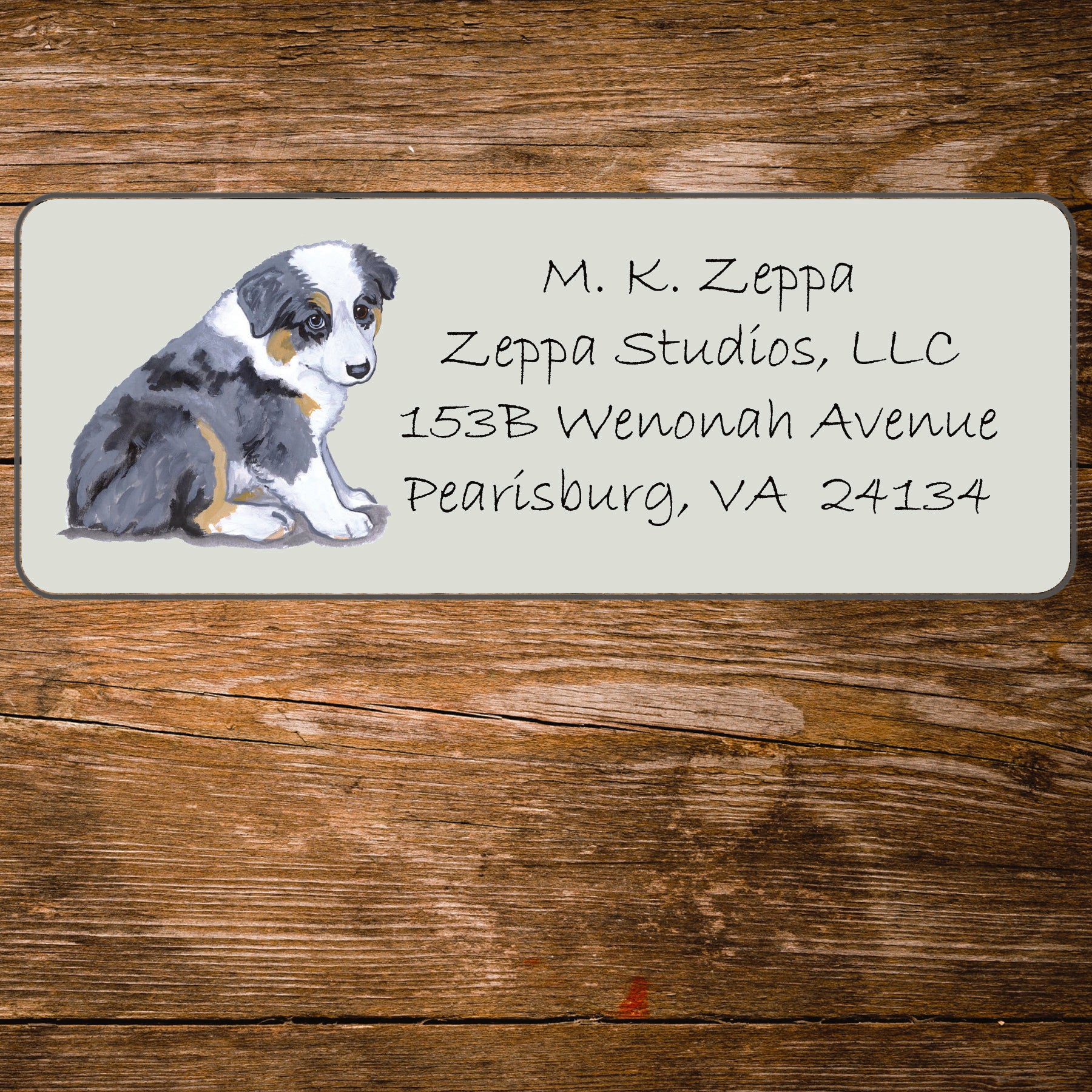 Address label with an Australian Shepherd Puppy illustration on a wooden background