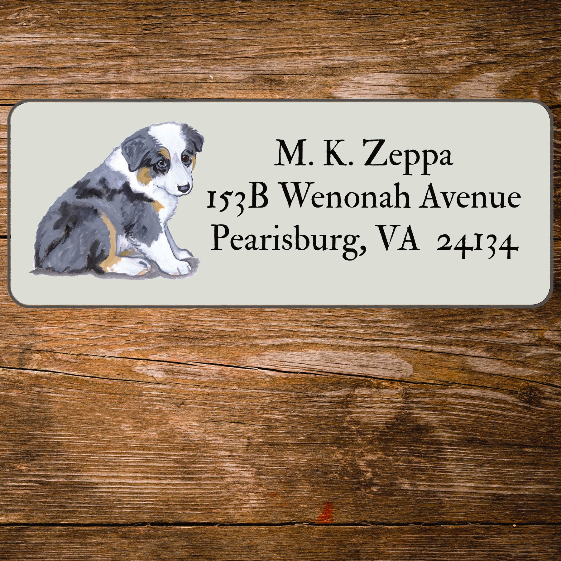 Address label with an Australian Shepherd Puppy illustration on a wooden background