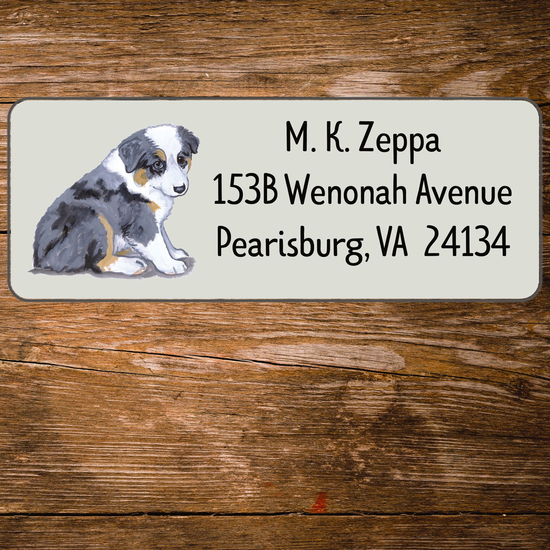 Address label with an Australian Shepherd Puppy illustration on a wooden background