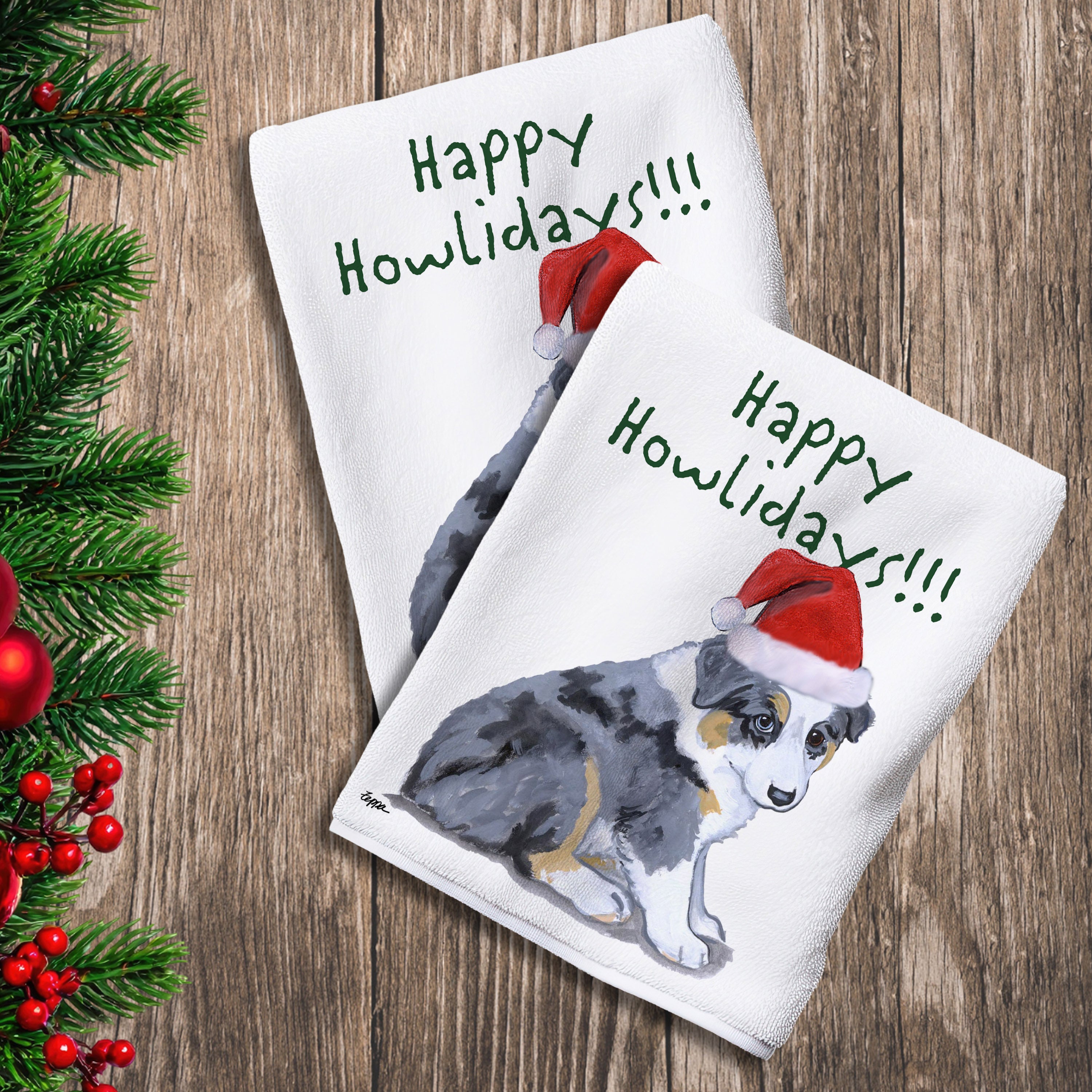 2 Kitchen Towels with an Australian Shepherd Puppy in a Santa Hat and Happy Howlidays text.