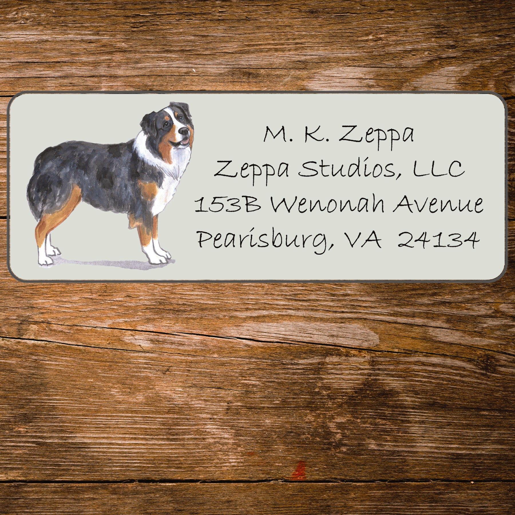 Address label with an Australian Shepherd Dog illustration on a wooden background