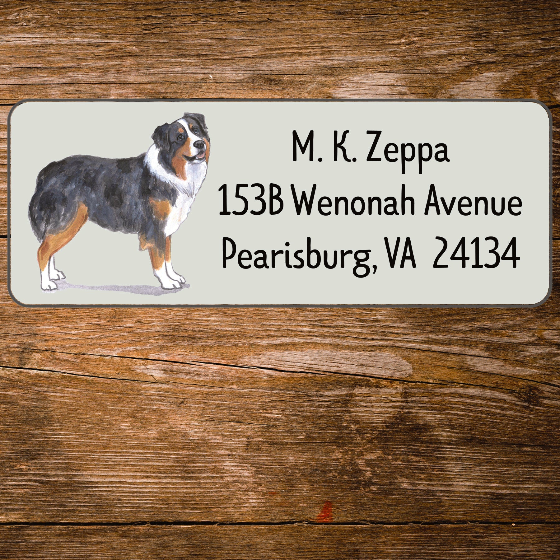 Address label with an Australian Shepherd Dog illustration on a wooden background