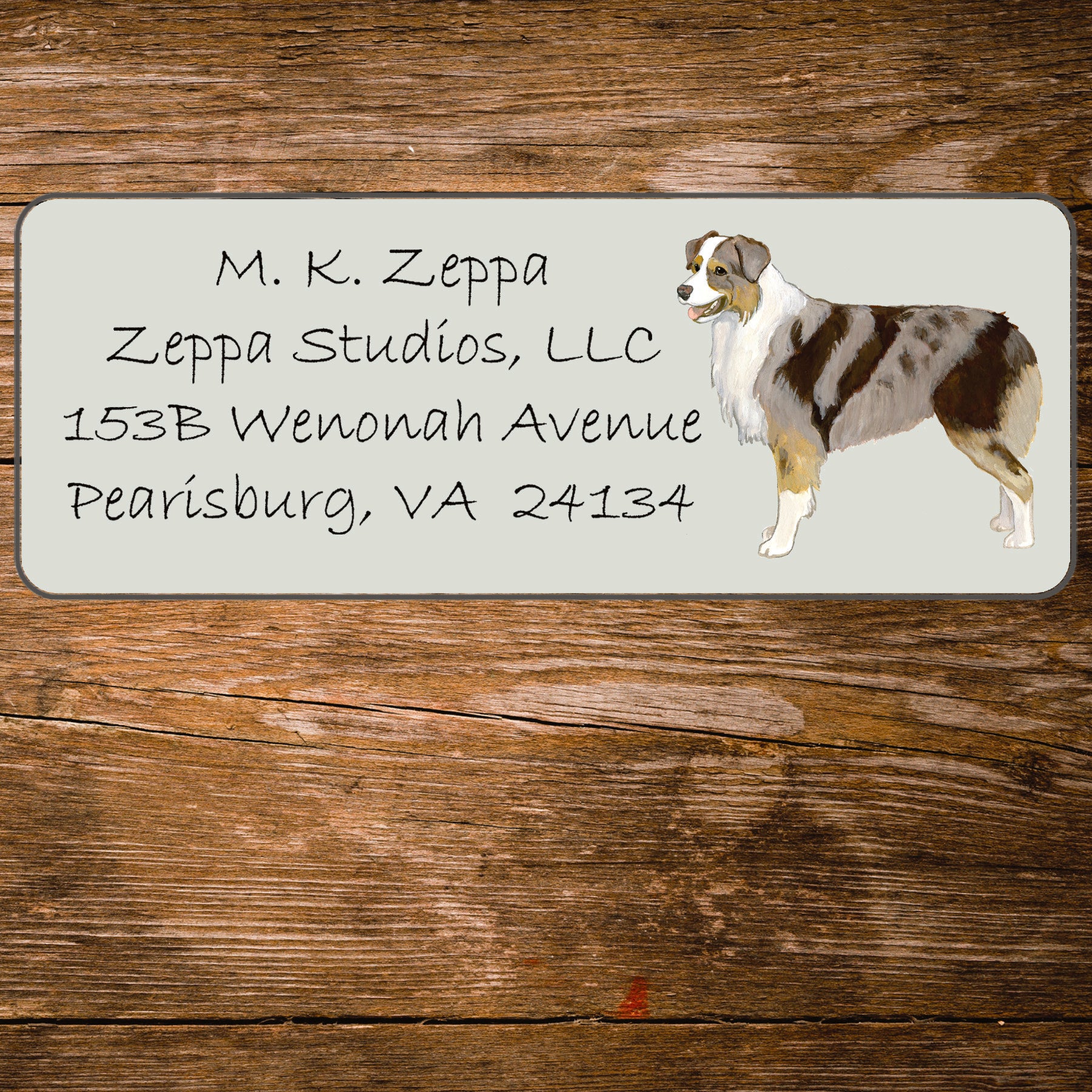 Address label with an Australian Shepherd Dog illustration on a wooden background