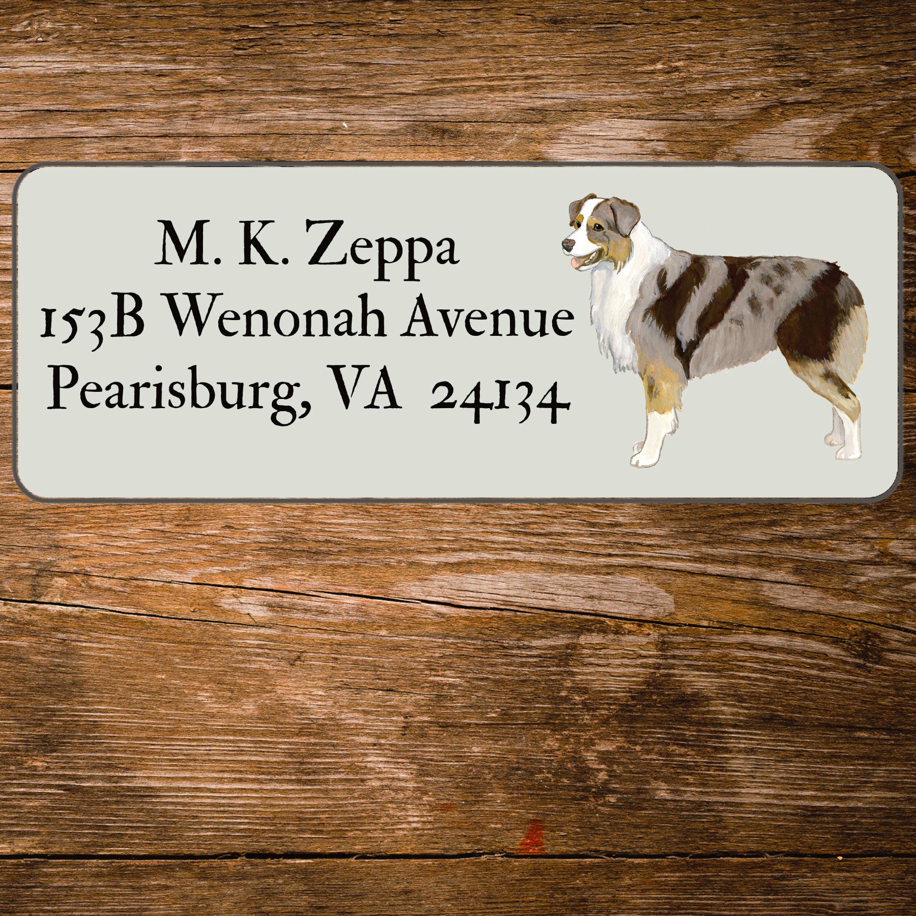 Address label with an Australian Shepherd Dog illustration on a wooden background