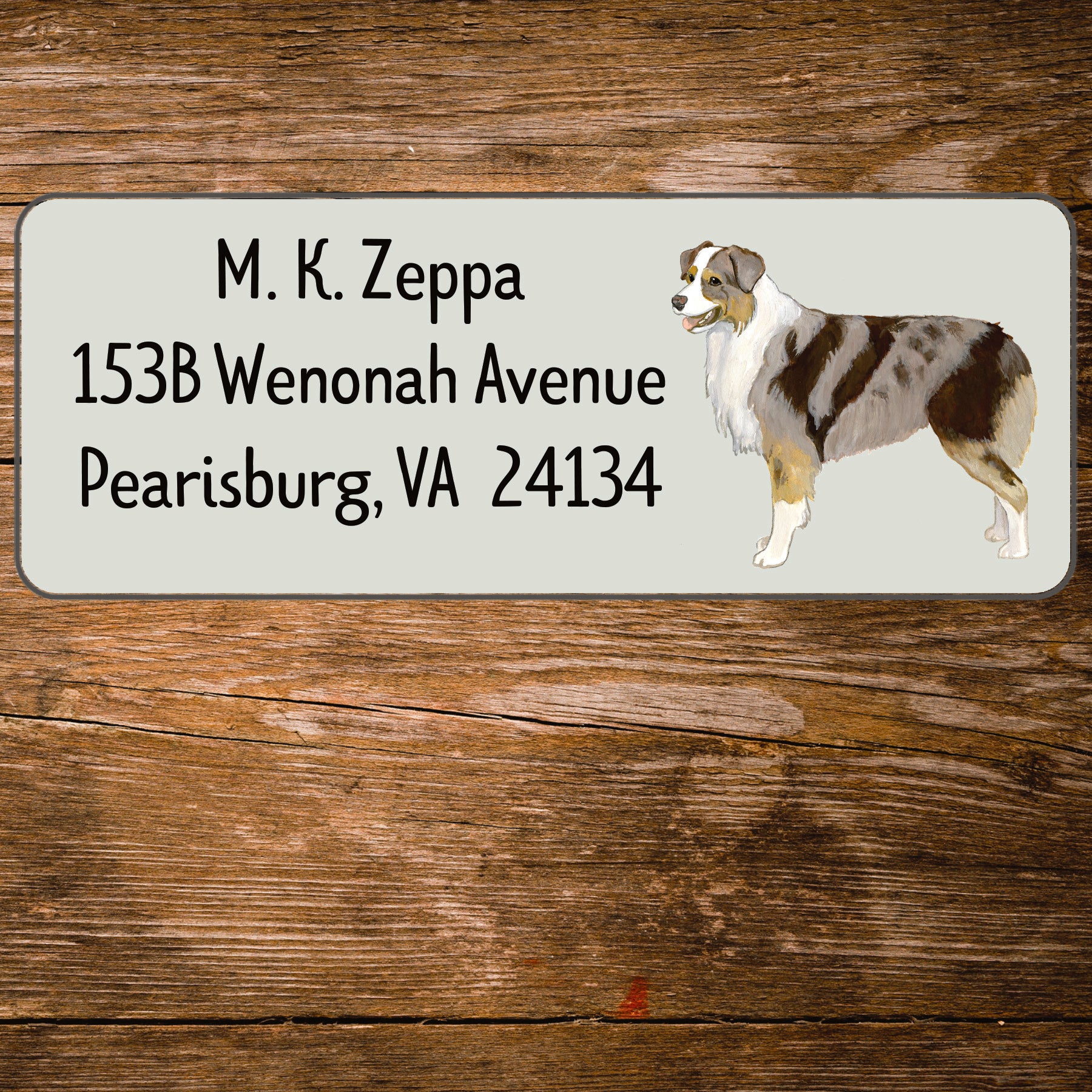 Address label with an Australian Shepherd Dog illustration on a wooden background