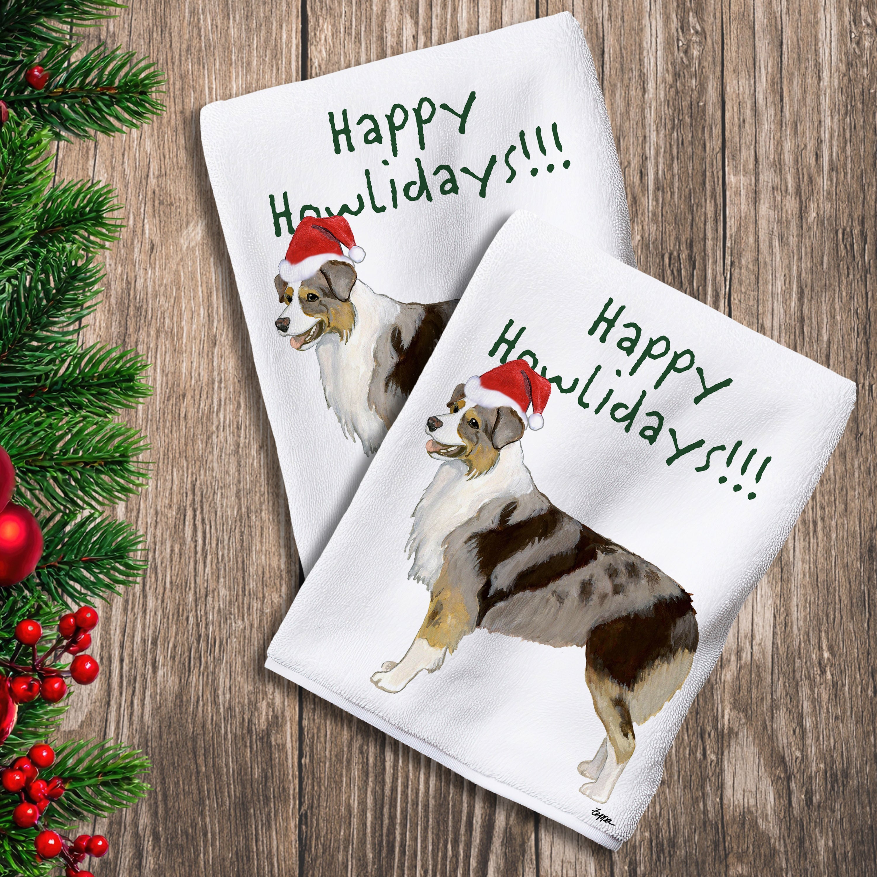 2 Kitchen Towels with a red merle Australian Shepherd in a Santa Hat and Happy Howlidays text.