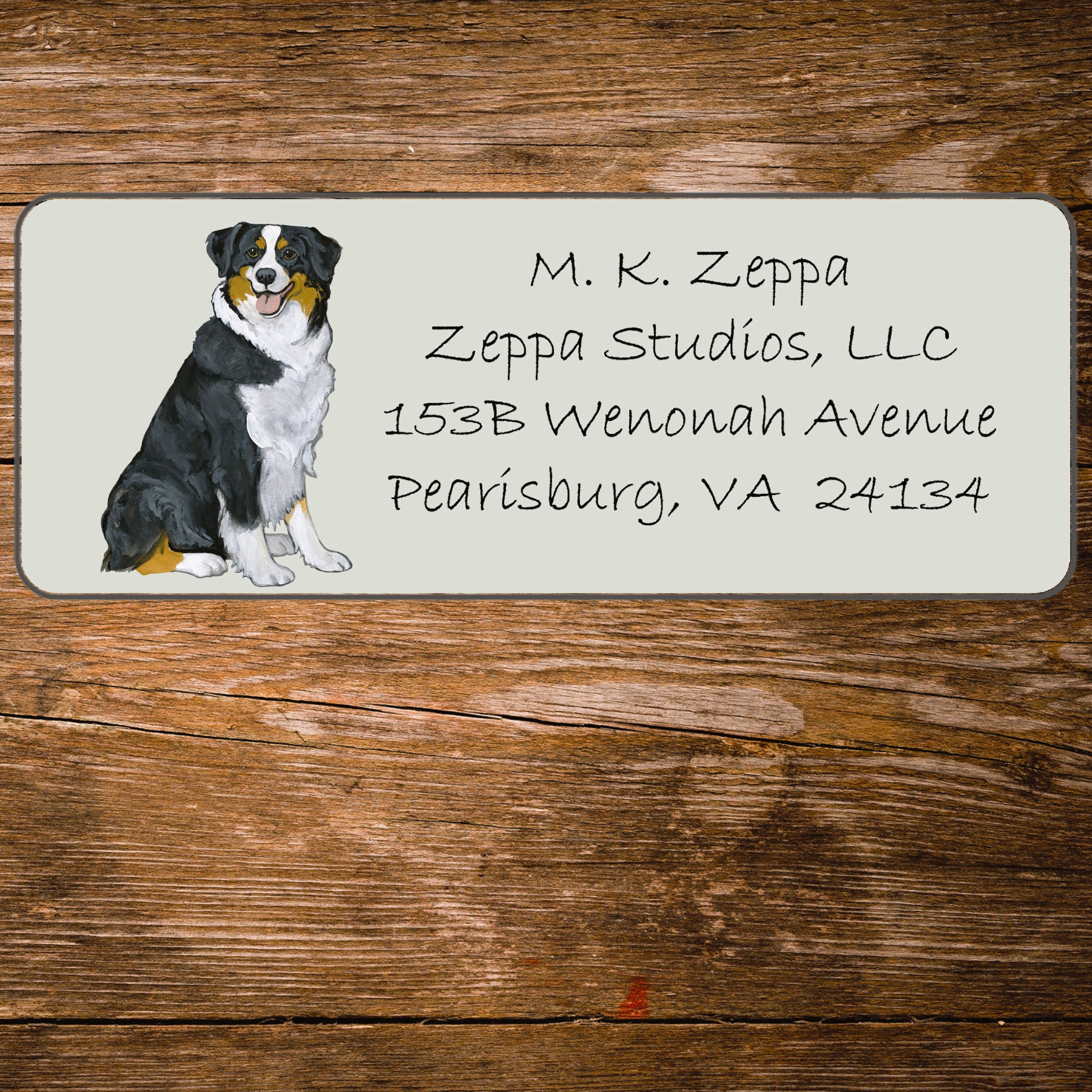 Address label with an Australian Shepherd Dog illustration on a wooden background