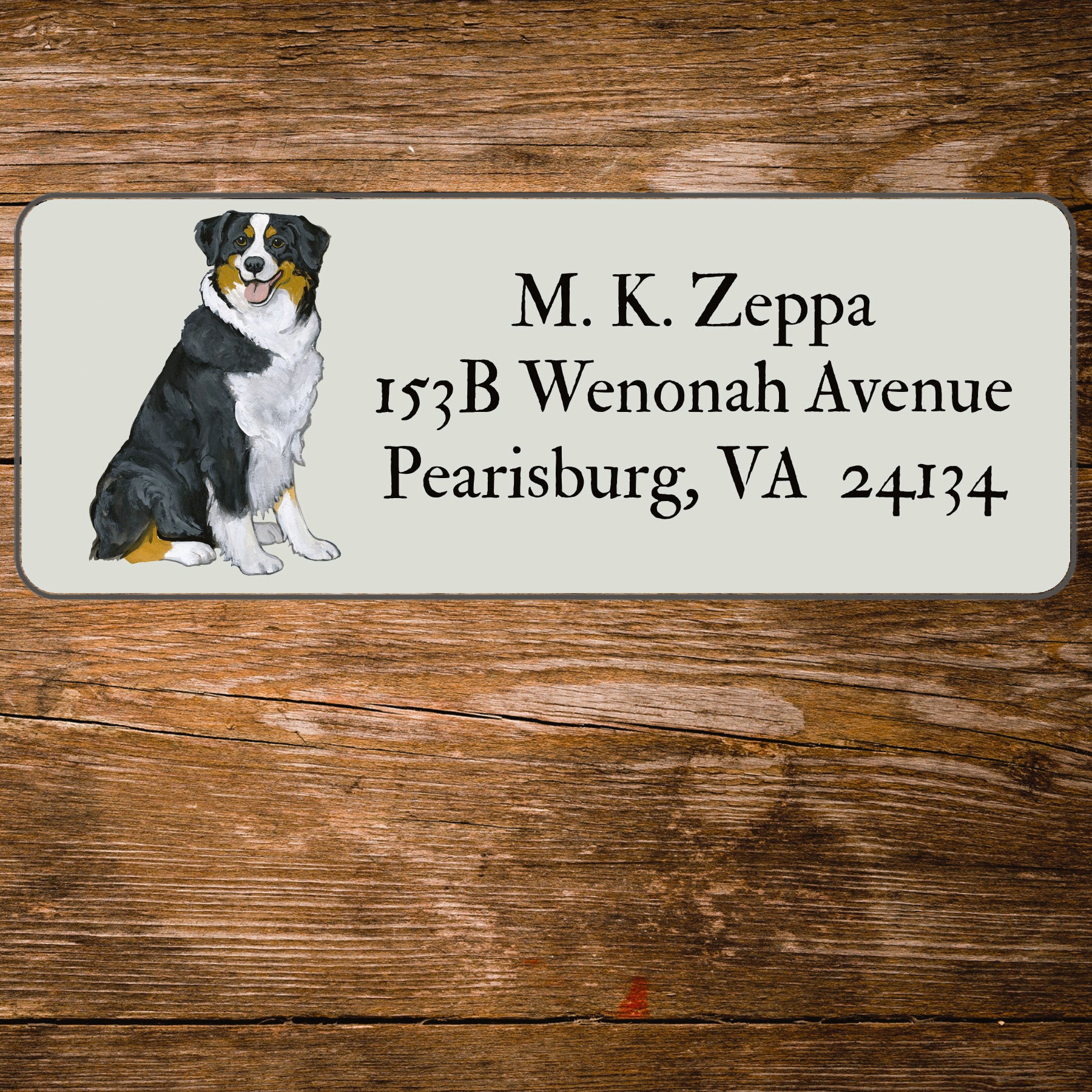 Address label with an Australian Shepherd Dog illustration on a wooden background
