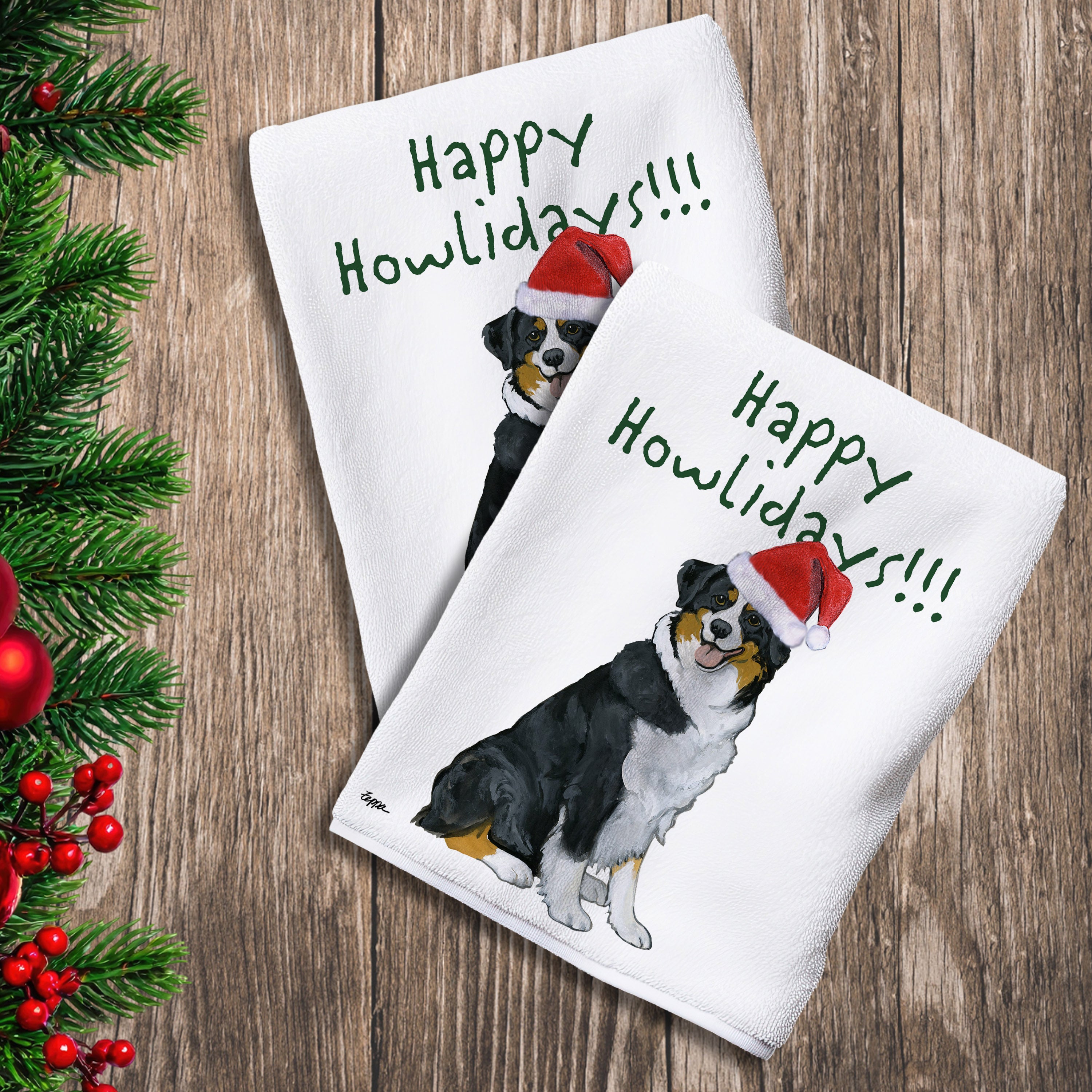 2 Kitchen Towels with a black tri color Australian Shepherd in a Santa Hat and Happy Howlidays text.