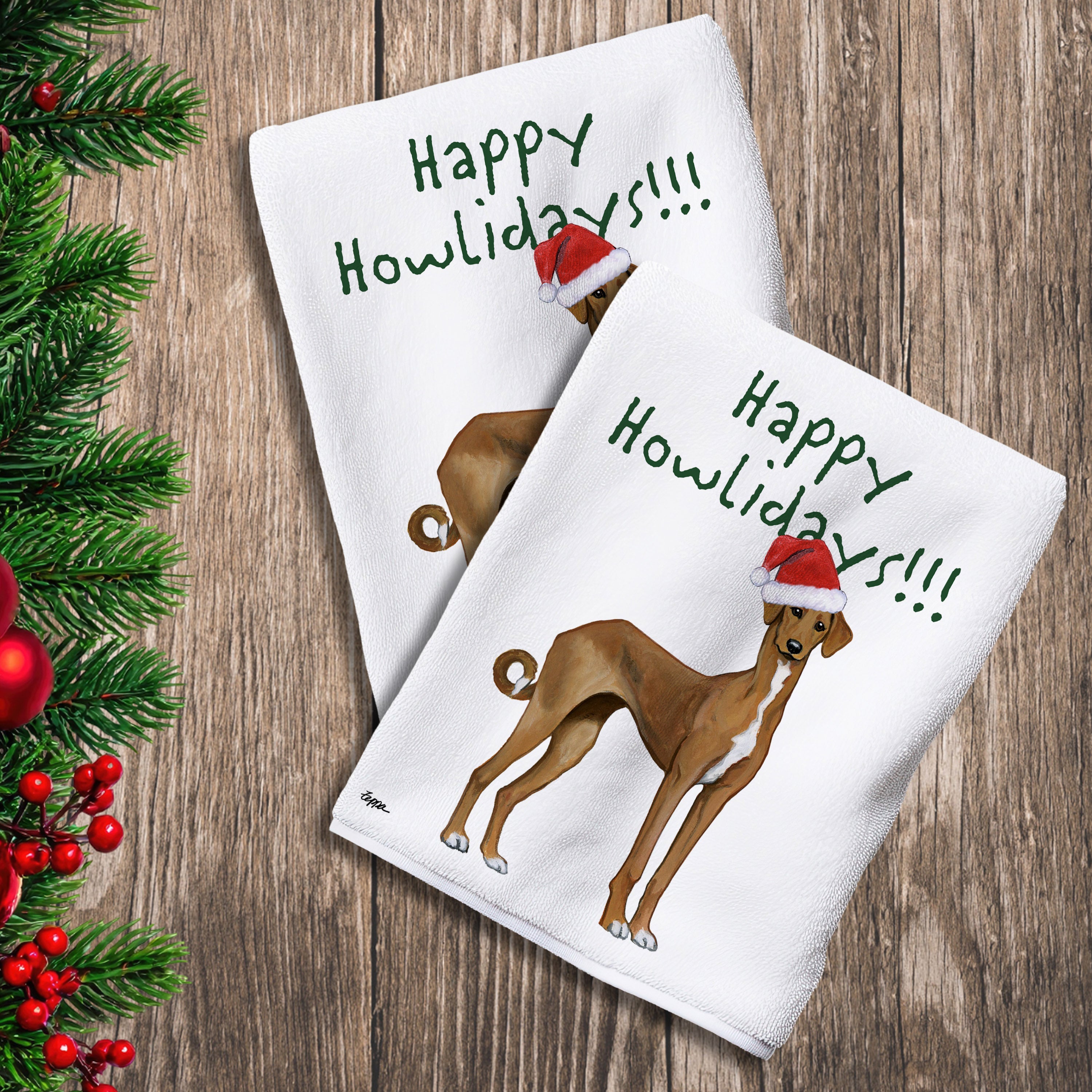 2 Kitchen Towels with a Azawakh in a Santa Hat and Happy Howlidays text.
