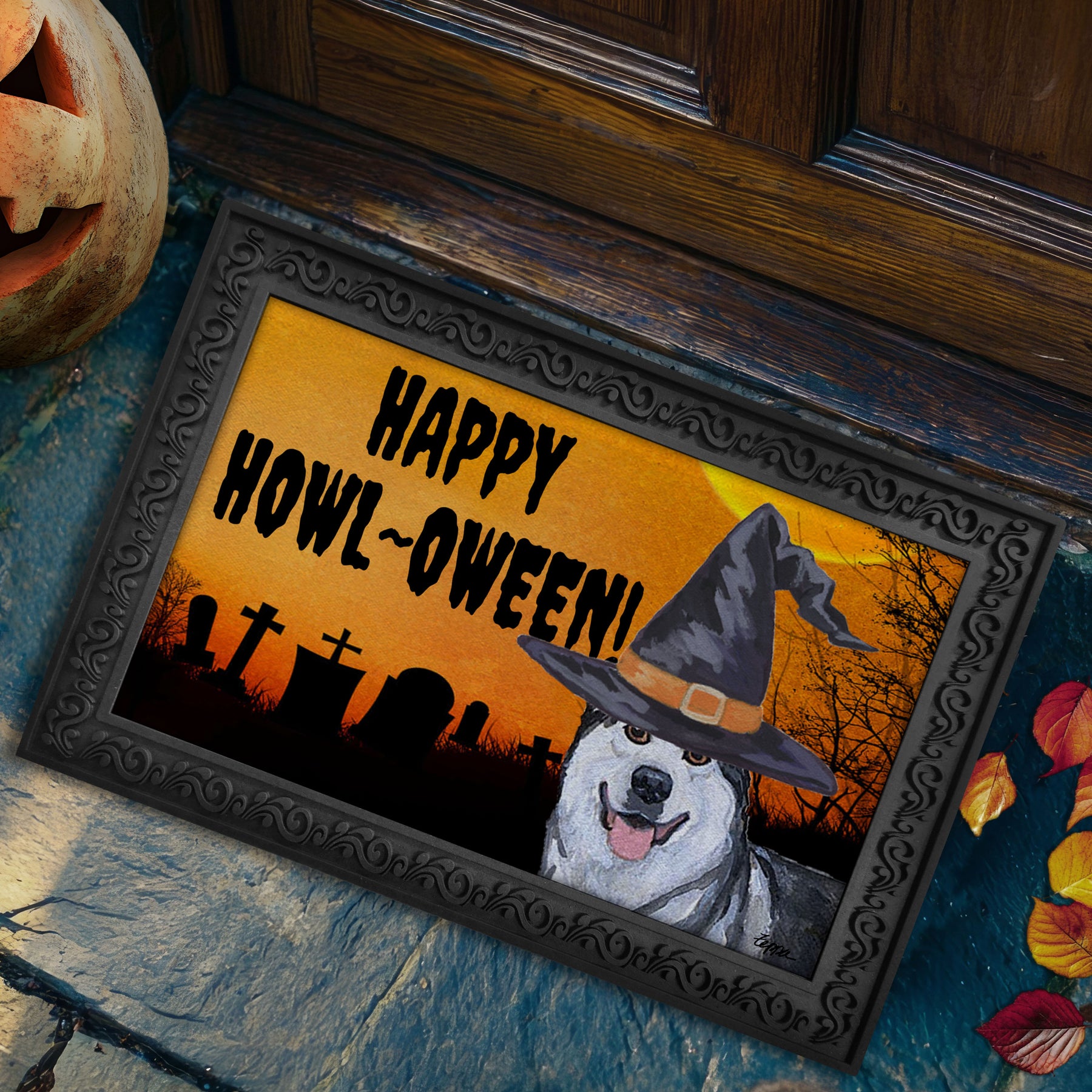 Halloween-themed doormat with a Alaskan Malamute wearing a witch hat and 'Happy Howl-Oween!' text on a doorstep.