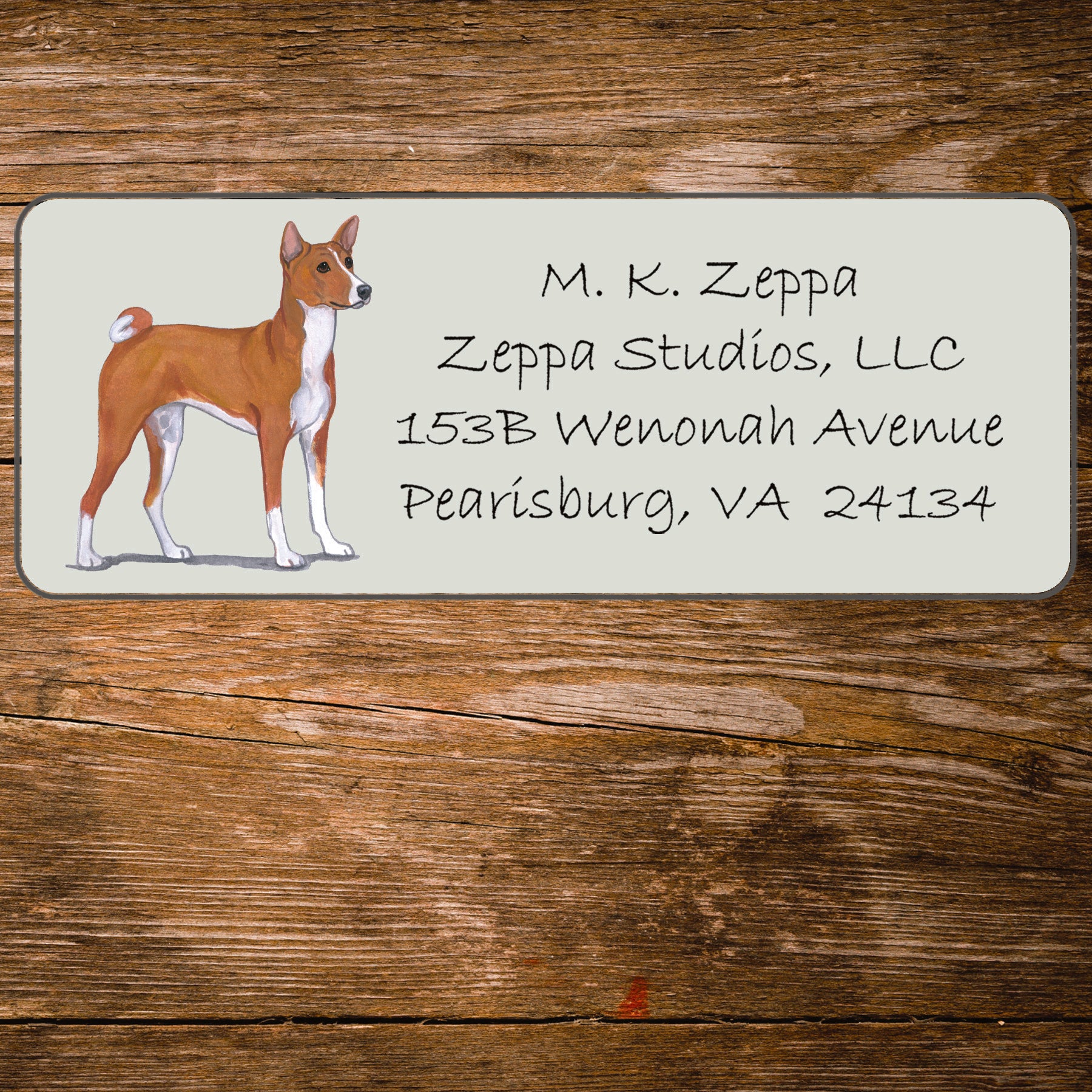 Address label with an Basenji illustration on a wooden background
