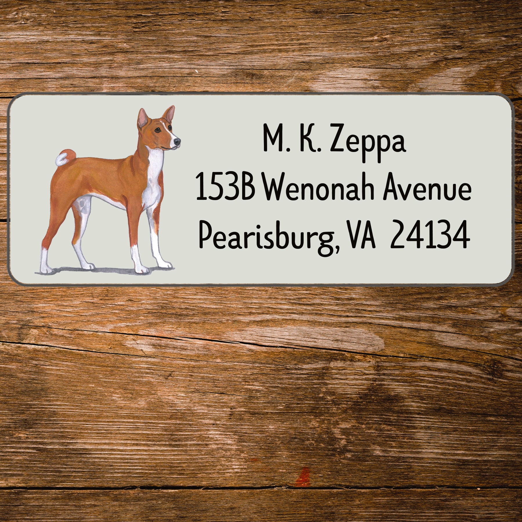 Address label with an Basenji illustration on a wooden background