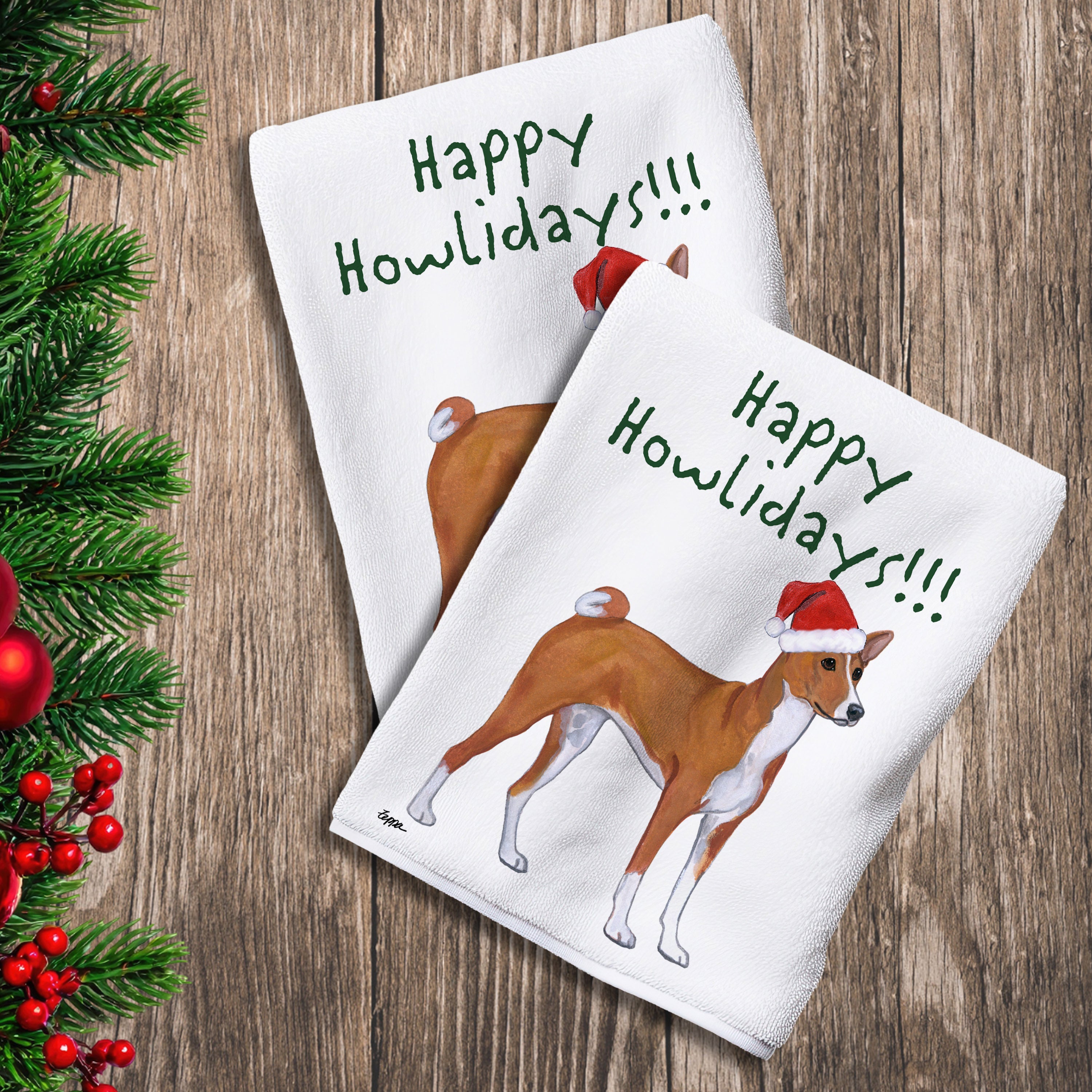 2 Kitchen Towels with a Basenji in a Santa Hat and Happy Howlidays text.