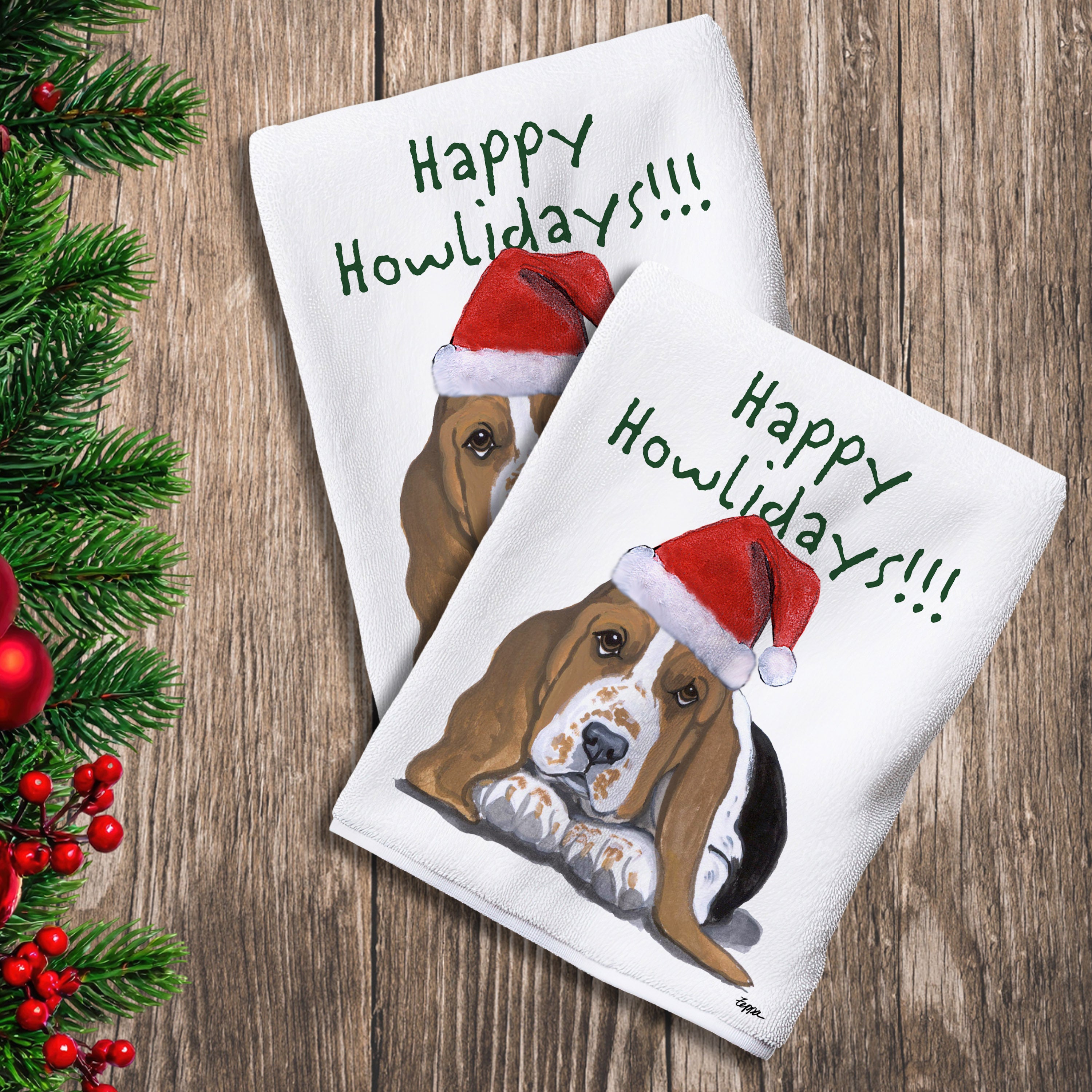 2 Kitchen Towels with a Basset Hound Puppy in a Santa Hat and Happy Howlidays text.