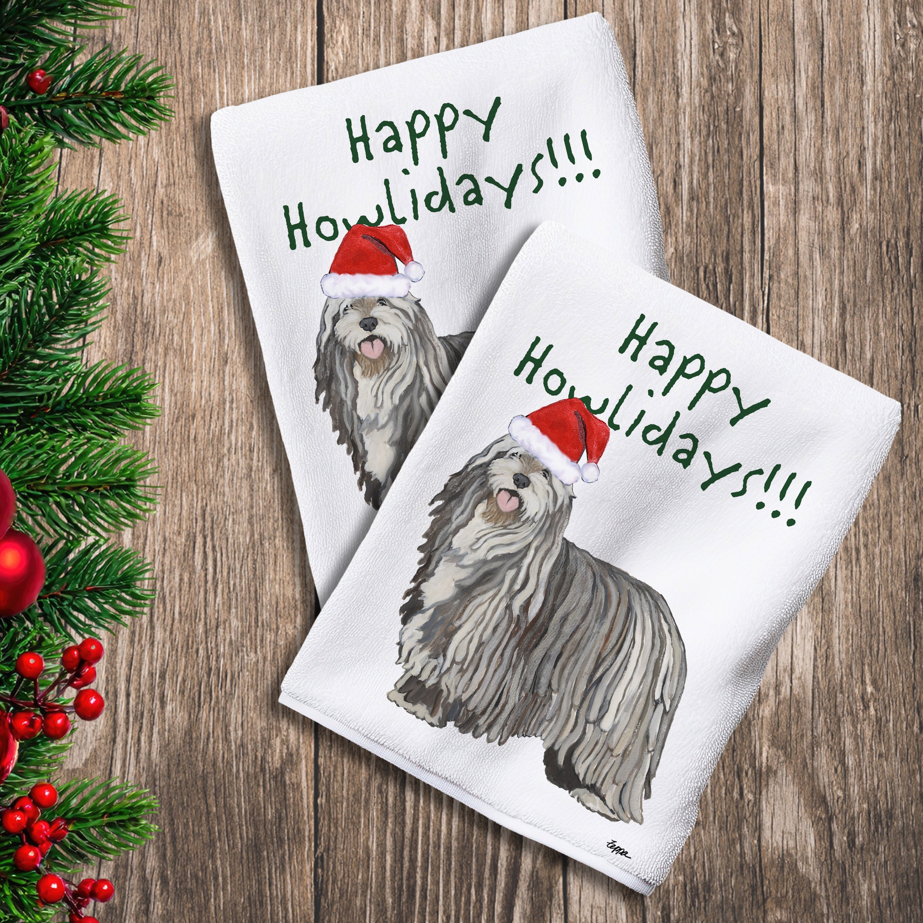 2 Kitchen Towels with a Bergamasco in a Santa Hat and Happy Howlidays text.