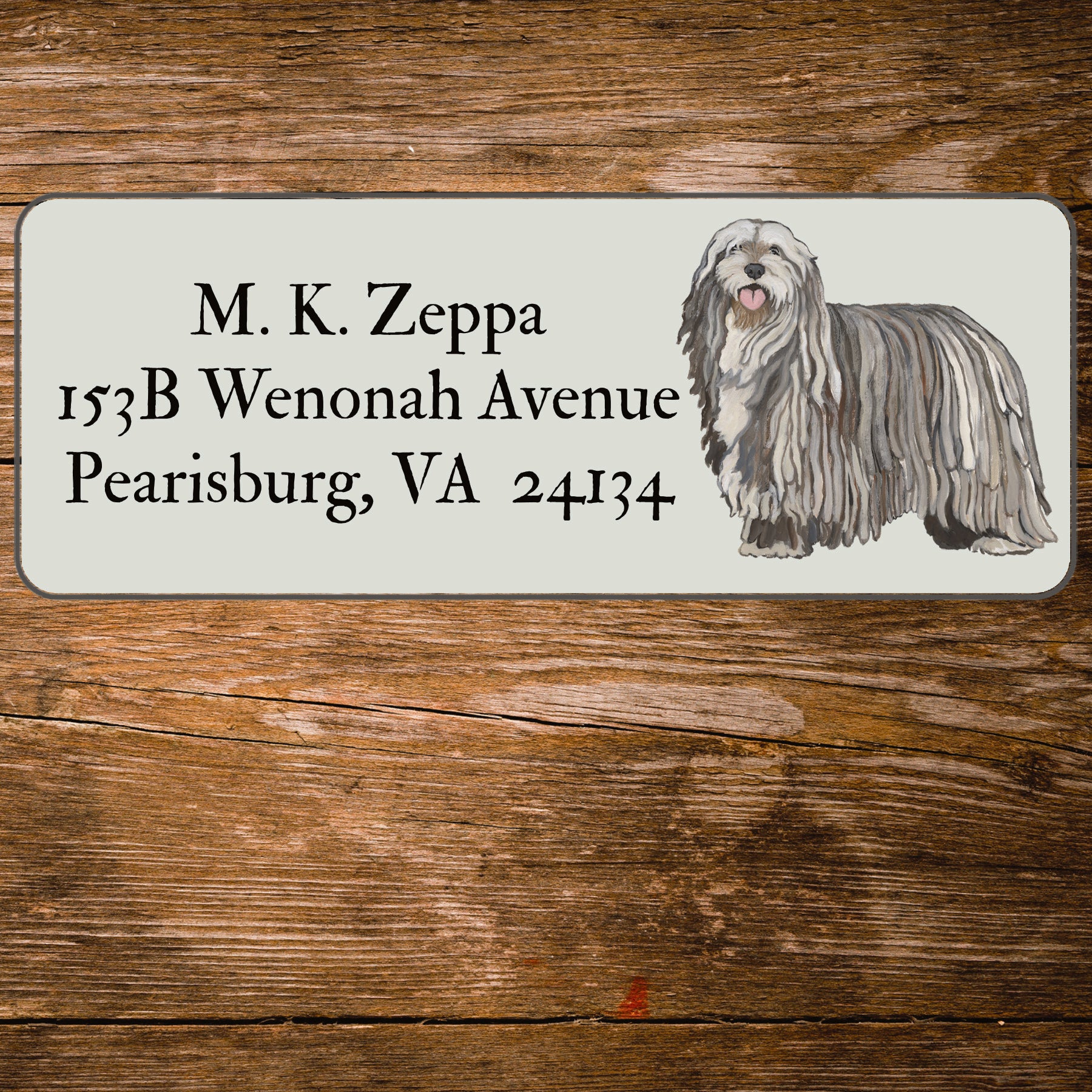 Return address label with an illustration of a Bergamasco
