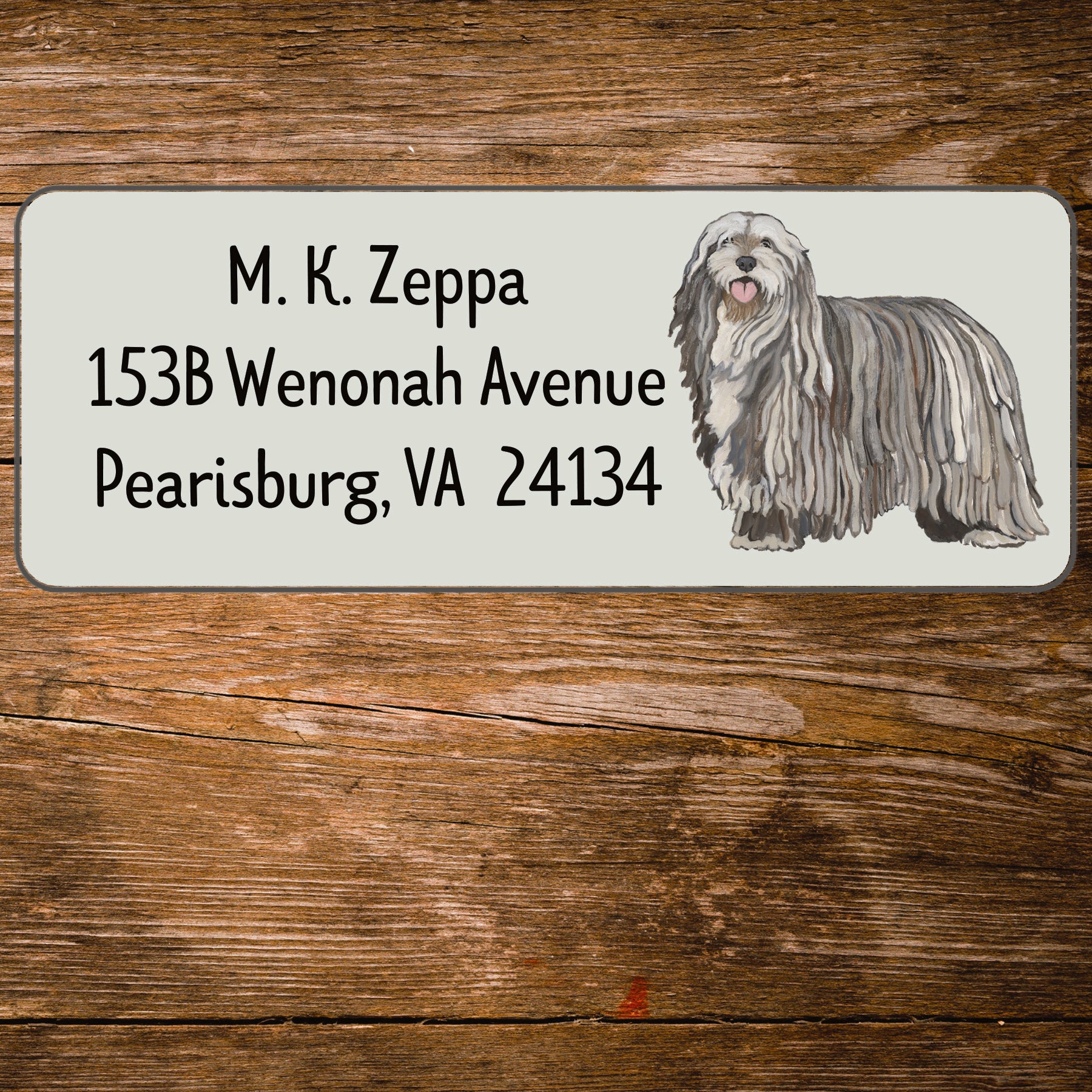 Return address label with an illustration of a Bergamasco