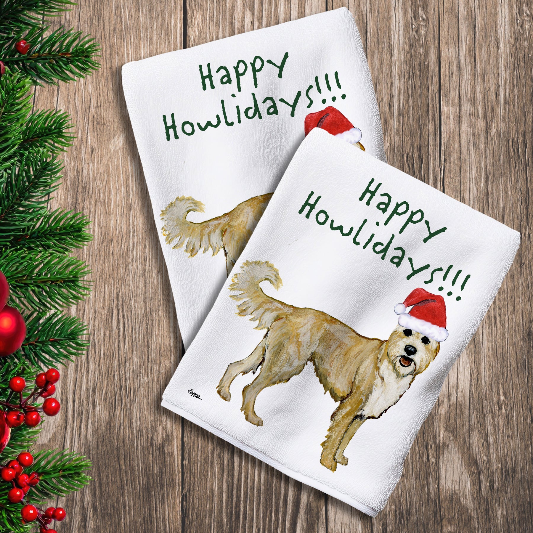 2 Kitchen Towels with a Berger Picard in a Santa Hat and Happy Howlidays text.
