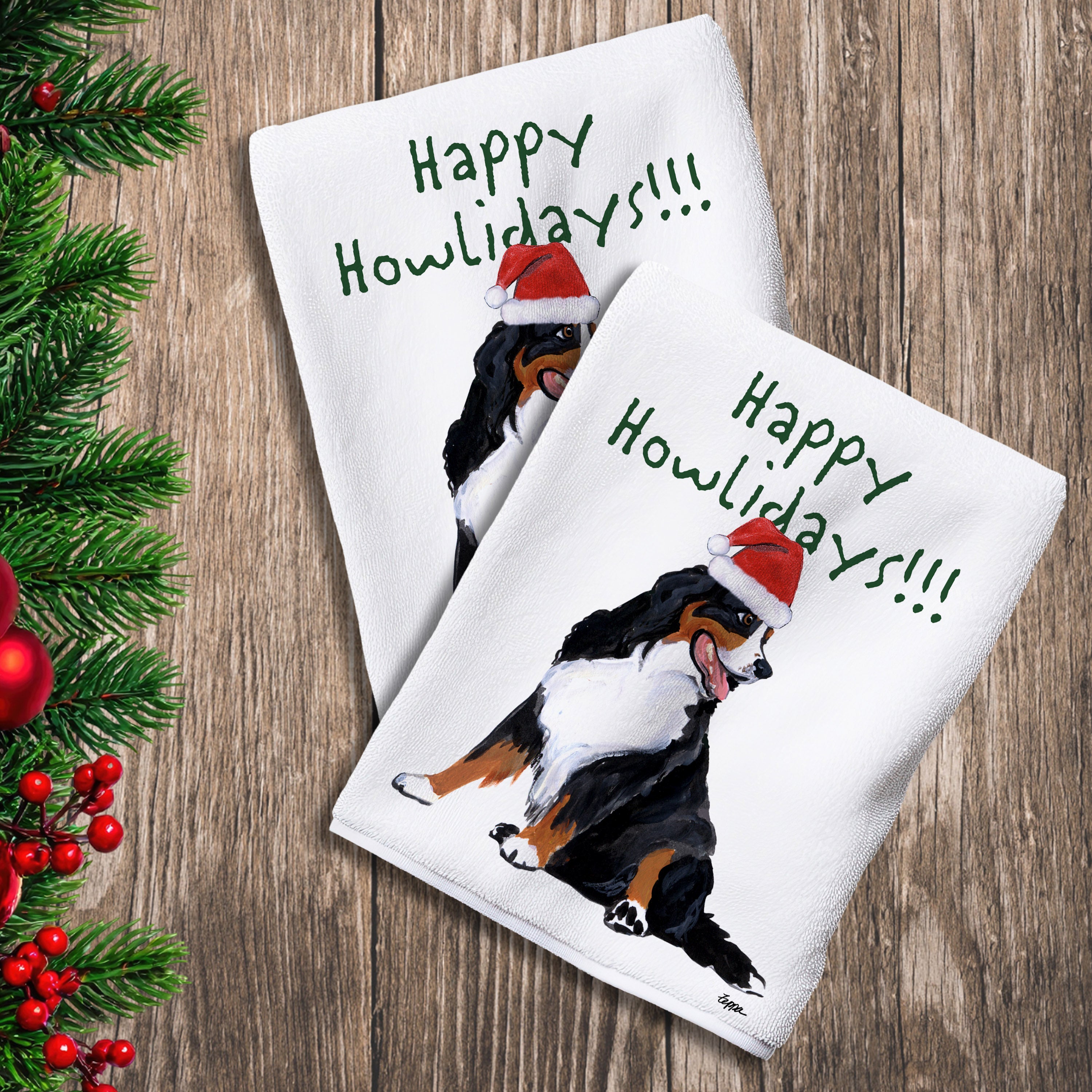 2 Kitchen Towels with a Bernese Mountain Dog in a Santa Hat and Happy Howlidays text.